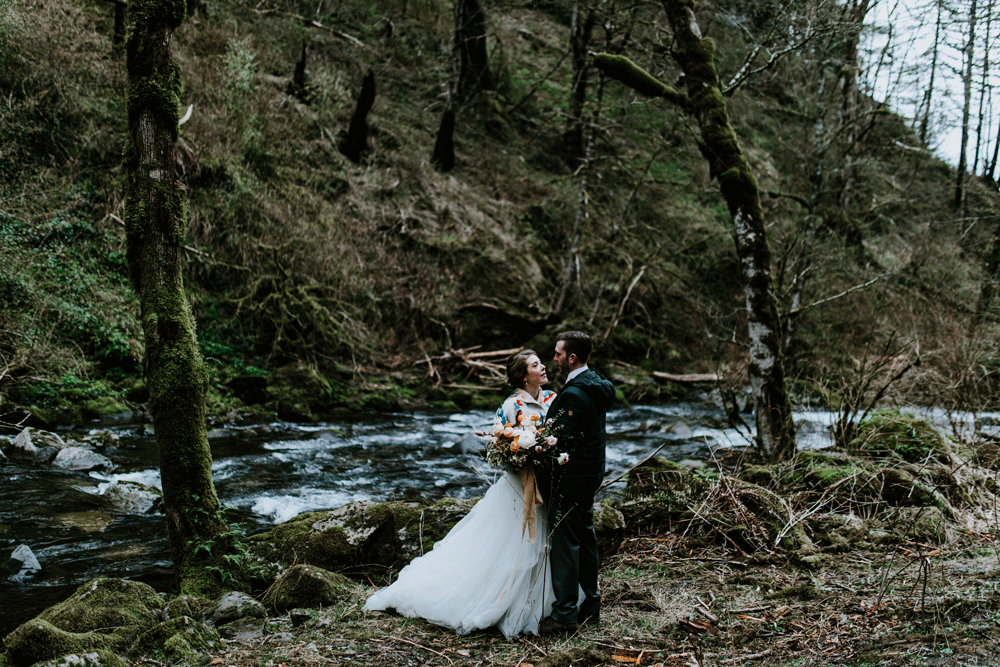 Allison and Lennie take a moment to talk near the stream. Elopement photography at Columbia River Gorge by Sienna Plus Josh.