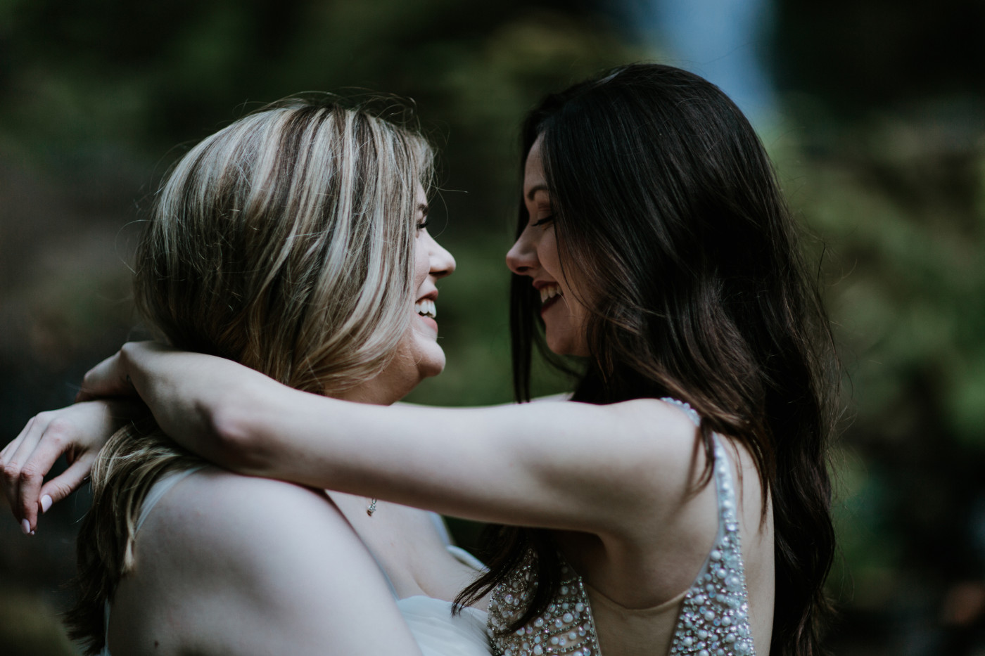 Tiffany and Hayley smile at each other. Elopement photography at the Columbia River Gorge by Sienna Plus Josh.