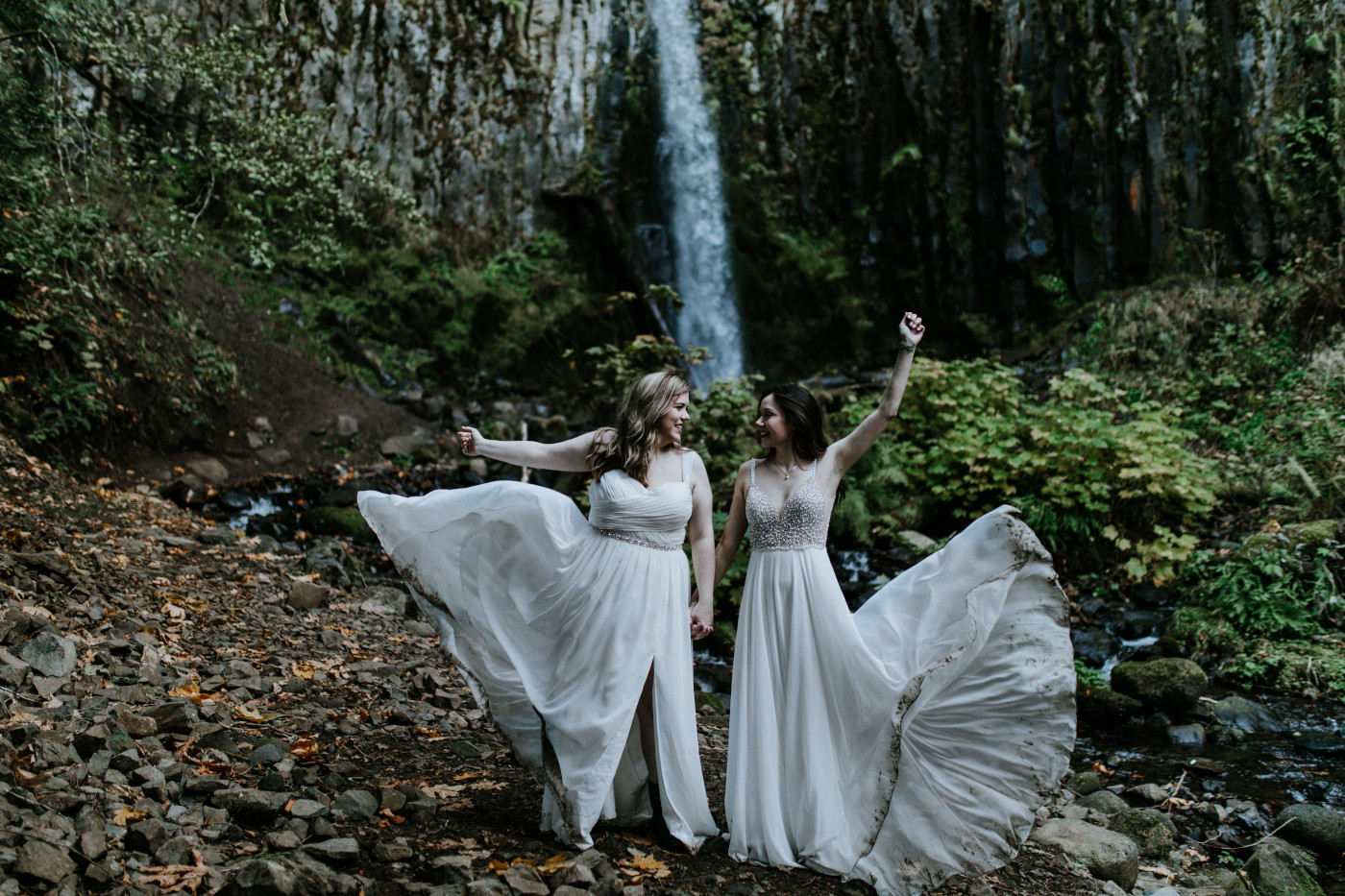 Hayley and Tiffany throw their dresses to the side. Elopement photography at the Columbia River Gorge by Sienna Plus Josh.