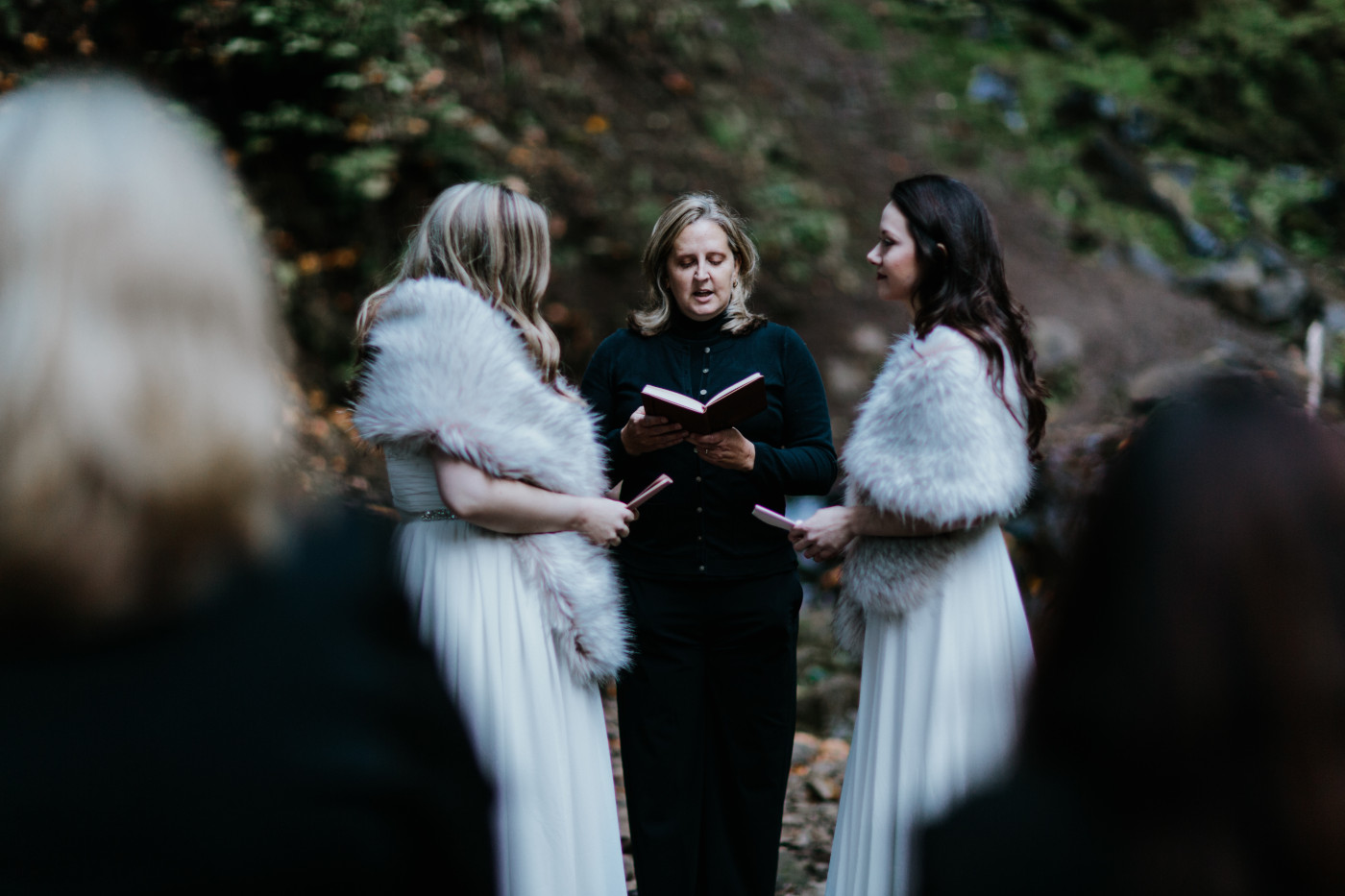 Tiffany and Hayley stand at their elopement ceremony. Elopement photography at the Columbia River Gorge by Sienna Plus Josh.