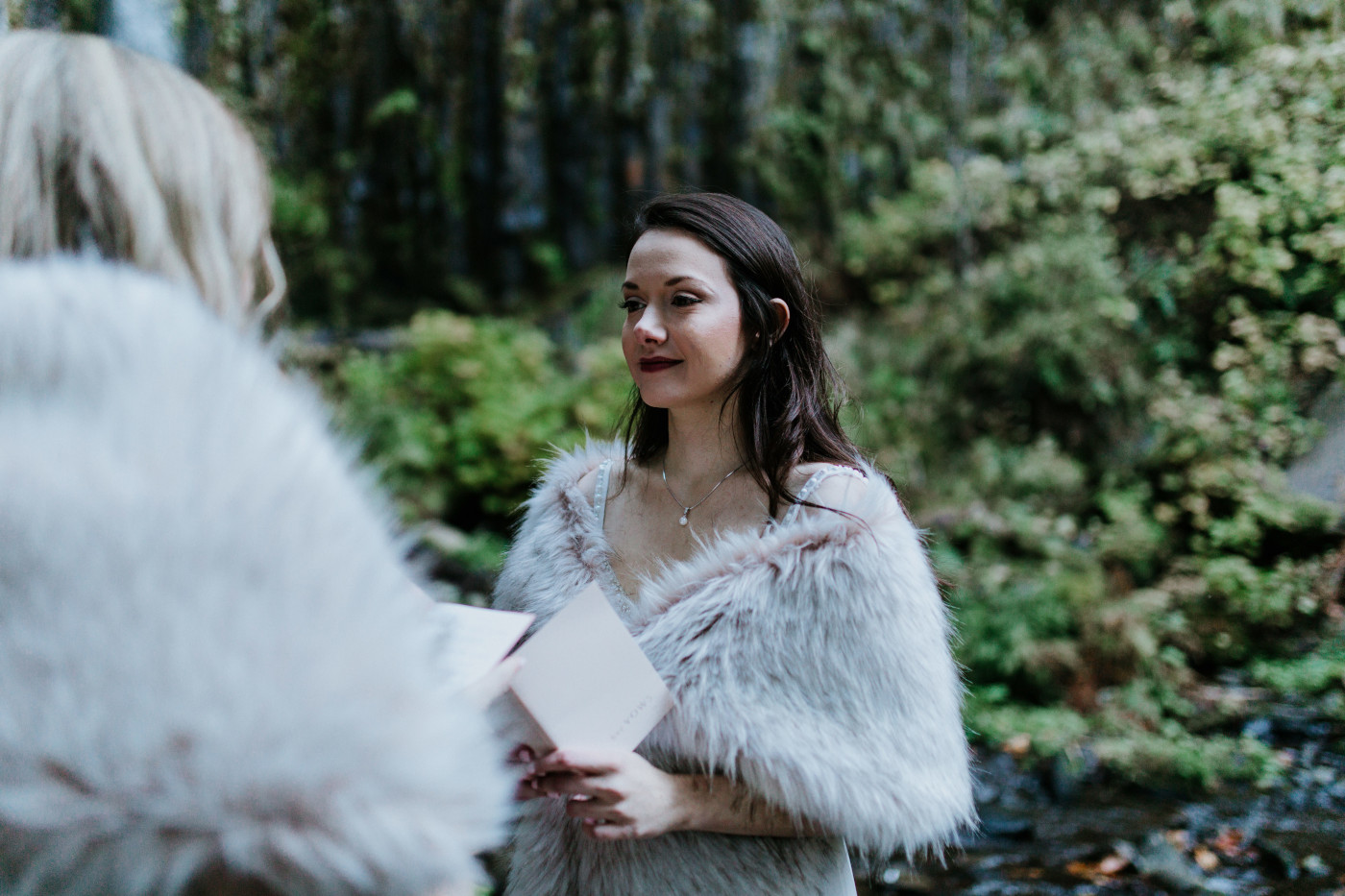 Tiffany admires Hayley. Elopement photography at the Columbia River Gorge by Sienna Plus Josh.