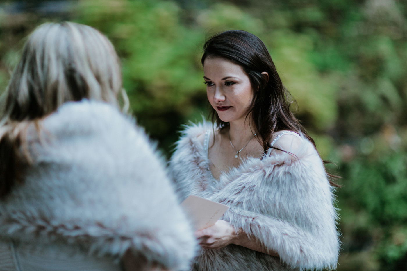 Hayley and Tiffany listen to the officiant. Elopement photography at the Columbia River Gorge by Sienna Plus Josh.