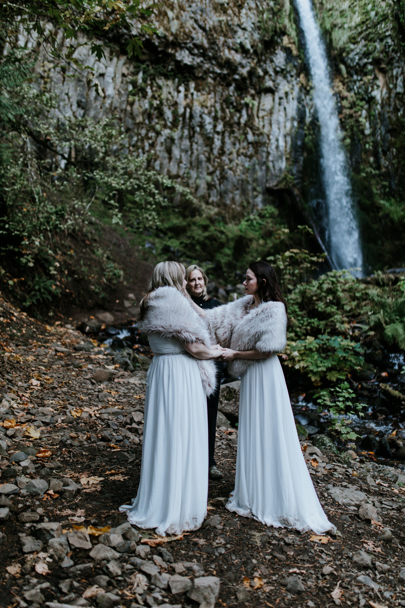 Hayley and Tiffany stand together at their elopement. Elopement photography at the Columbia River Gorge by Sienna Plus Josh.