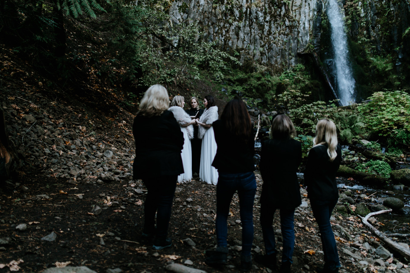 Tiffany and Hayley stand before their loved ones. Elopement photography at the Columbia River Gorge by Sienna Plus Josh.