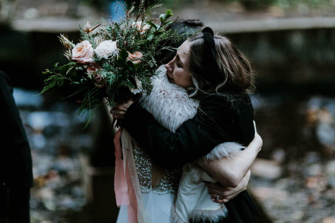 The brides hug family and friends. Elopement photography at the Columbia River Gorge by Sienna Plus Josh.