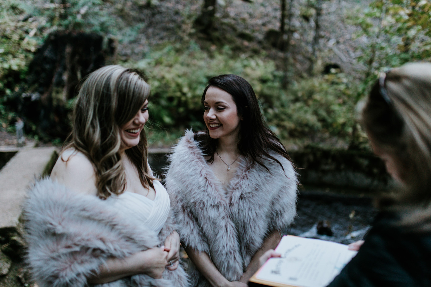 Hayley and Tiffany get ready to sign their marriage license. Elopement photography at the Columbia River Gorge by Sienna Plus Josh.