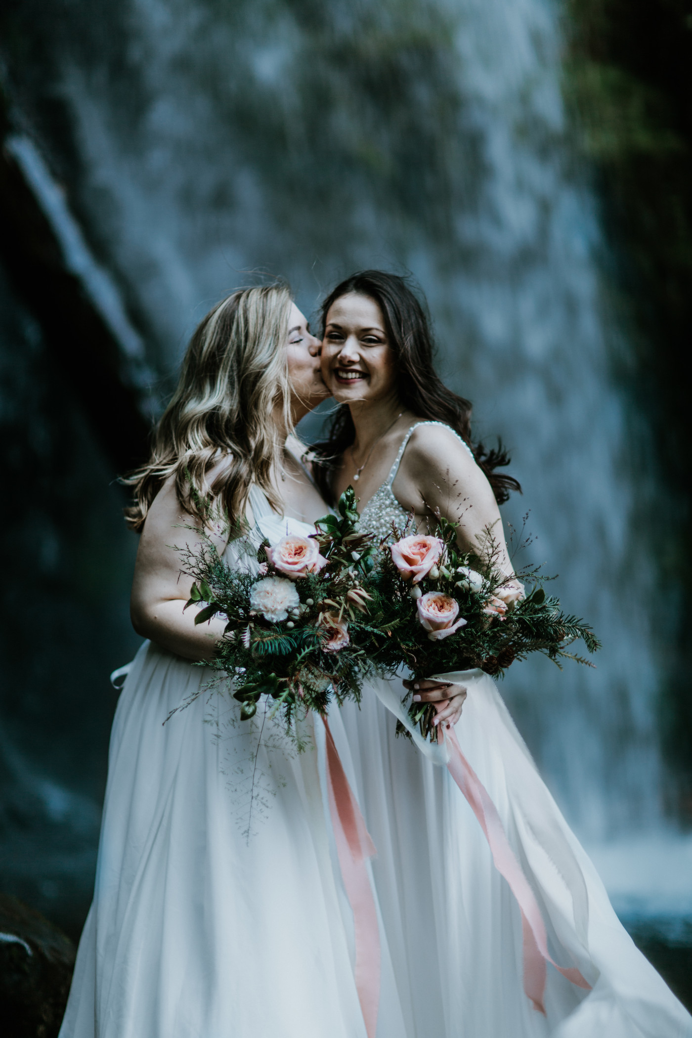 Hayley kisses Tiffany. Elopement photography at the Columbia River Gorge by Sienna Plus Josh.