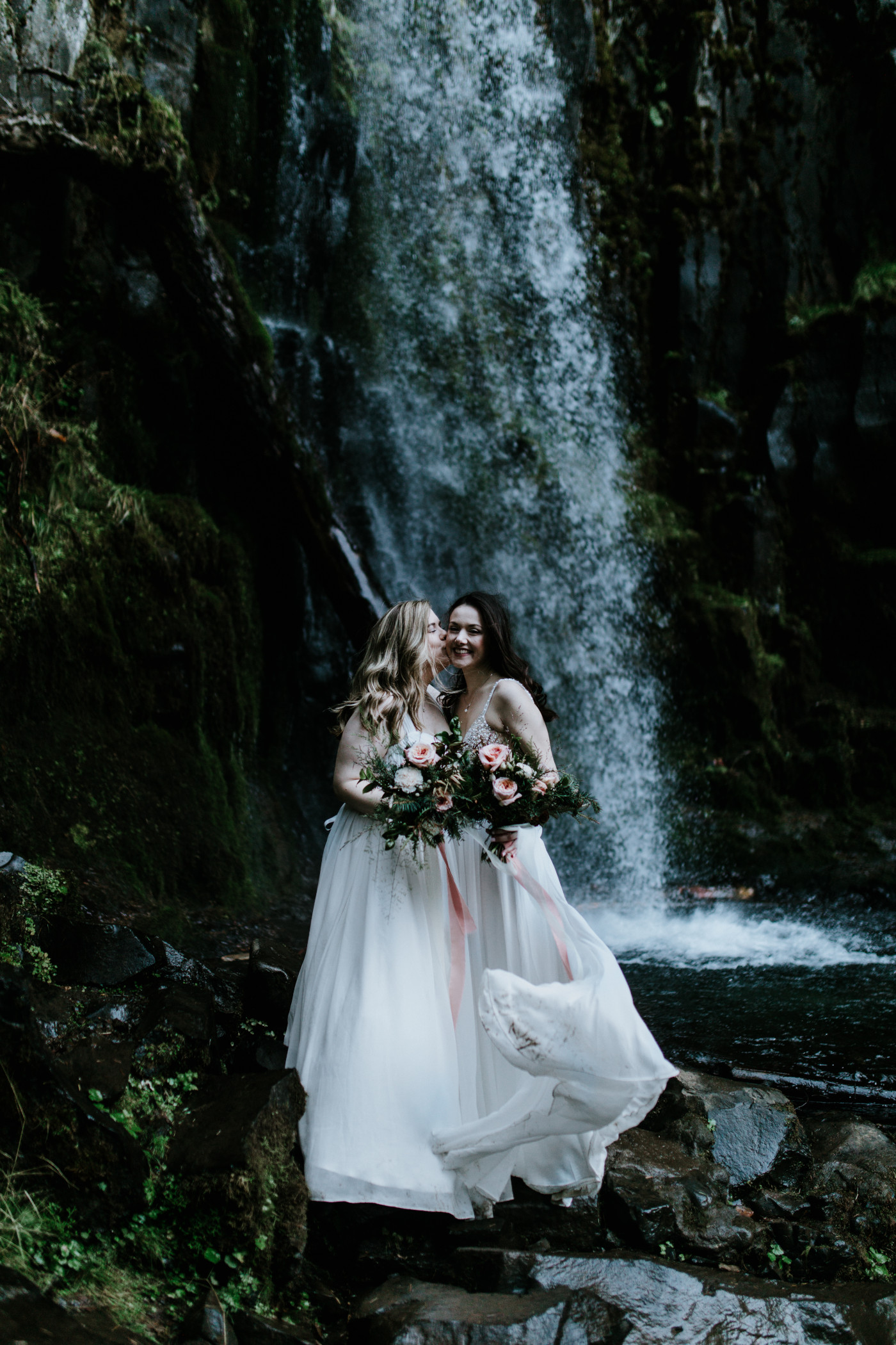 Tiffany gives Hayley a kiss. Elopement photography at the Columbia River Gorge by Sienna Plus Josh.