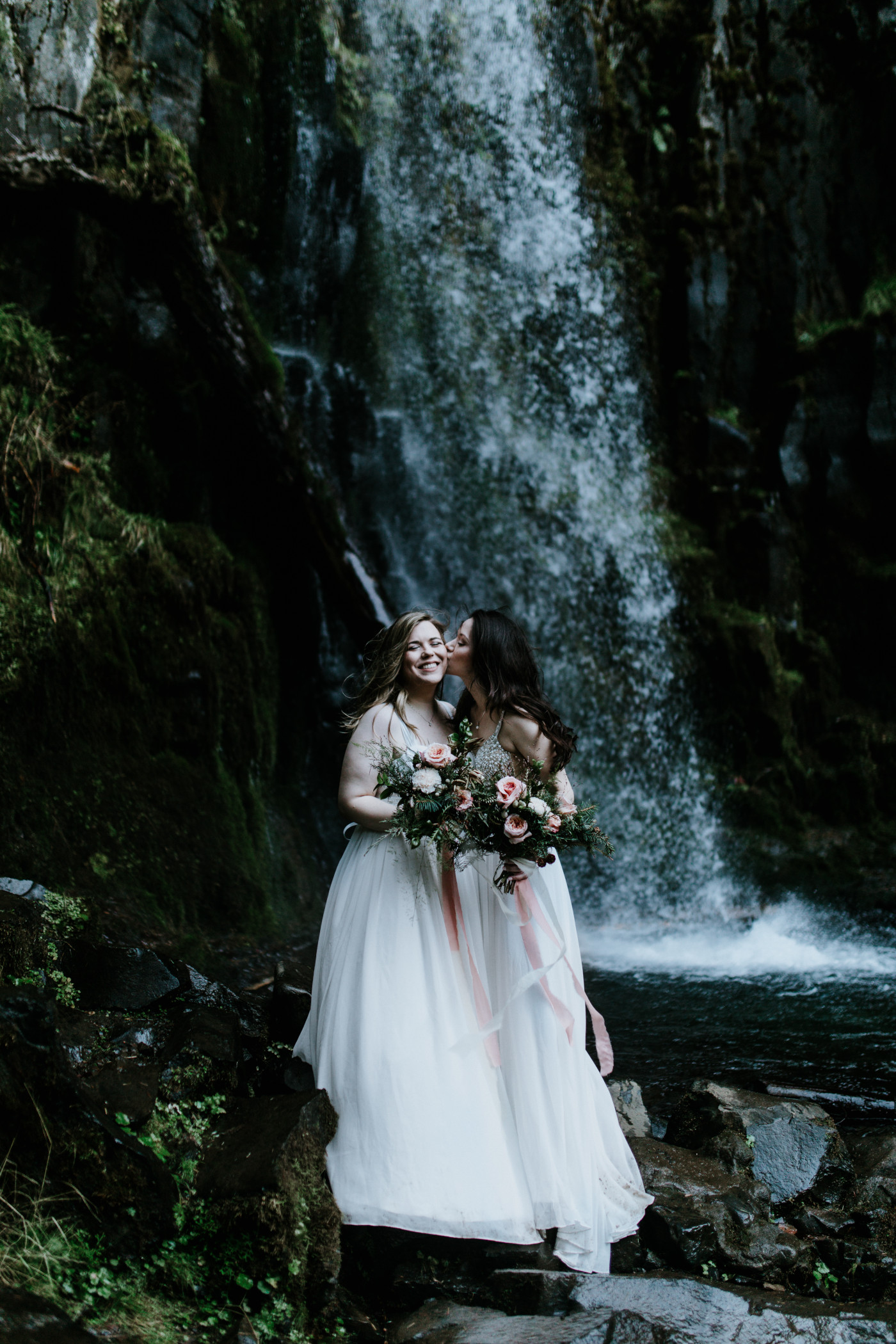 Tiffany kisses Hayley. Elopement photography at the Columbia River Gorge by Sienna Plus Josh.