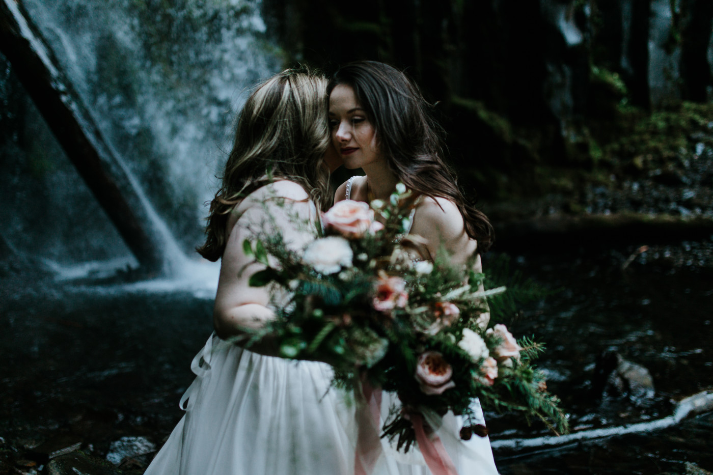 Elopement couple near a waterfall in the Columbia River Gorge. Elopement photography at the Columbia River Gorge by Sienna Plus Josh.
