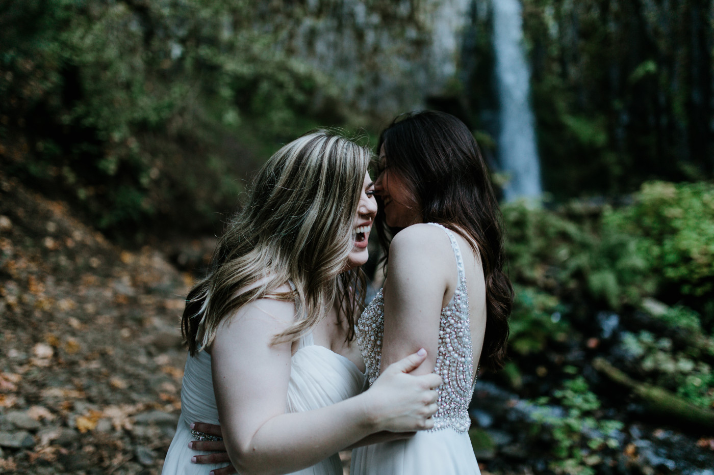 Hayley and Tiffany laugh. Elopement photography at the Columbia River Gorge by Sienna Plus Josh.