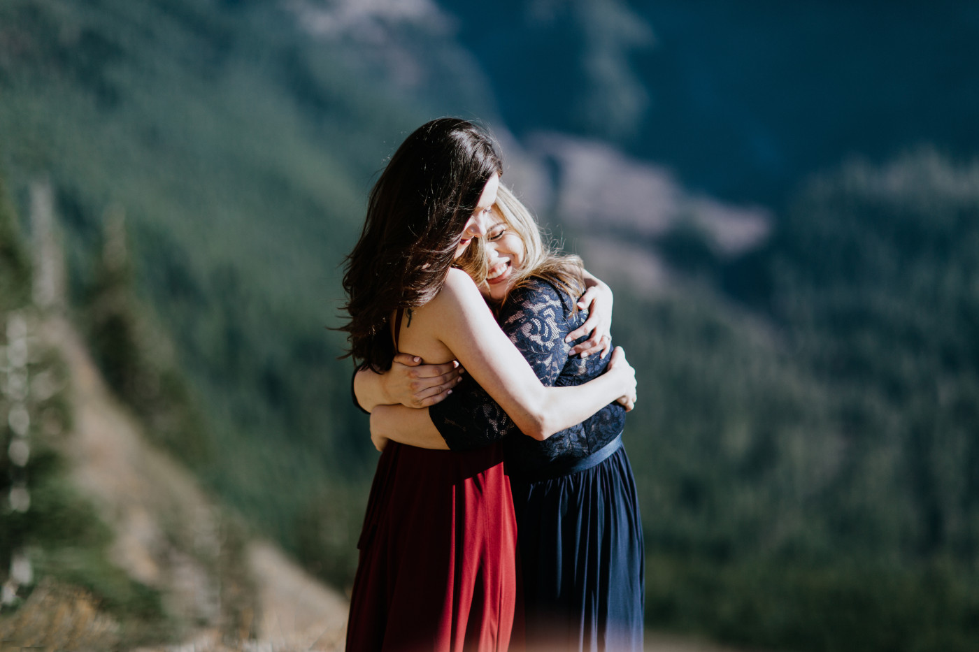 Tiffany and Hayley hold each other. Elopement photography at the Columbia River Gorge by Sienna Plus Josh.
