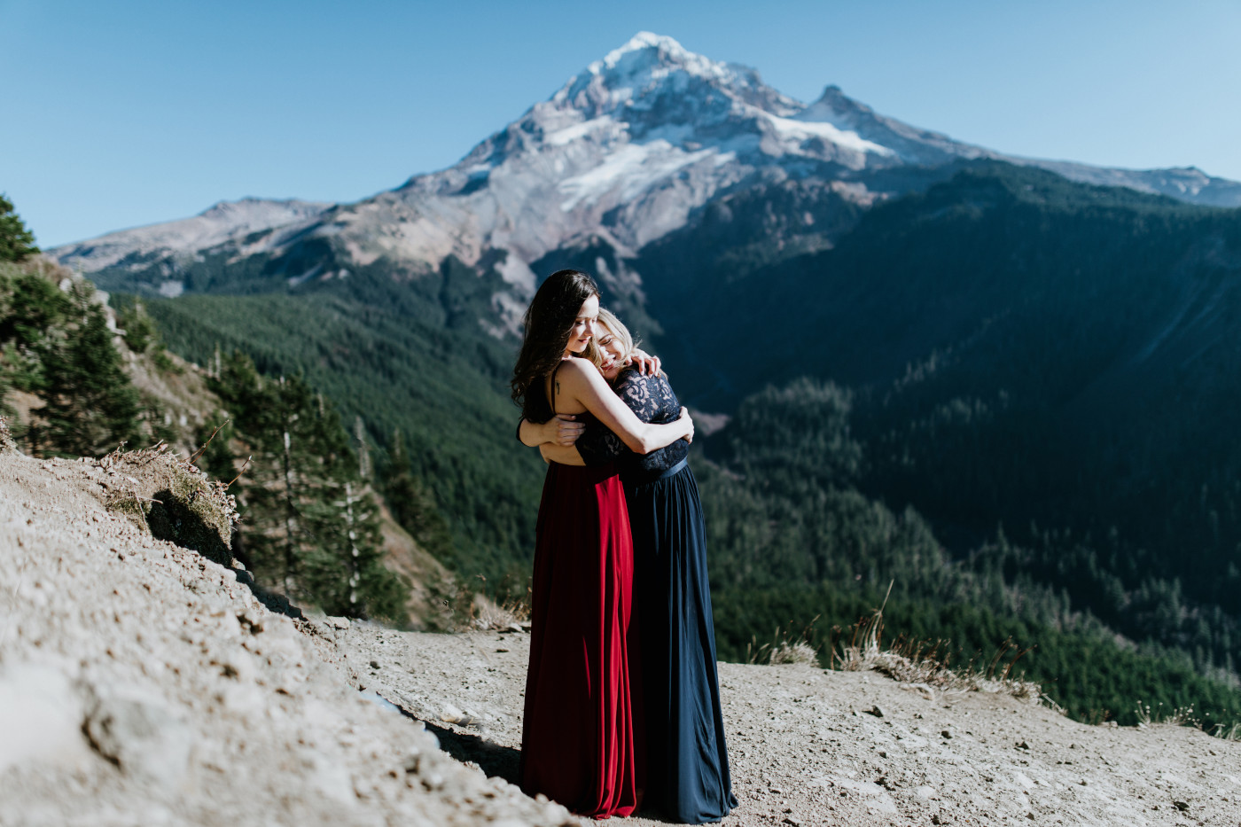 Tiffany and Hayley stand together with Mt Hood in the background. Elopement photography at the Columbia River Gorge by Sienna Plus Josh.