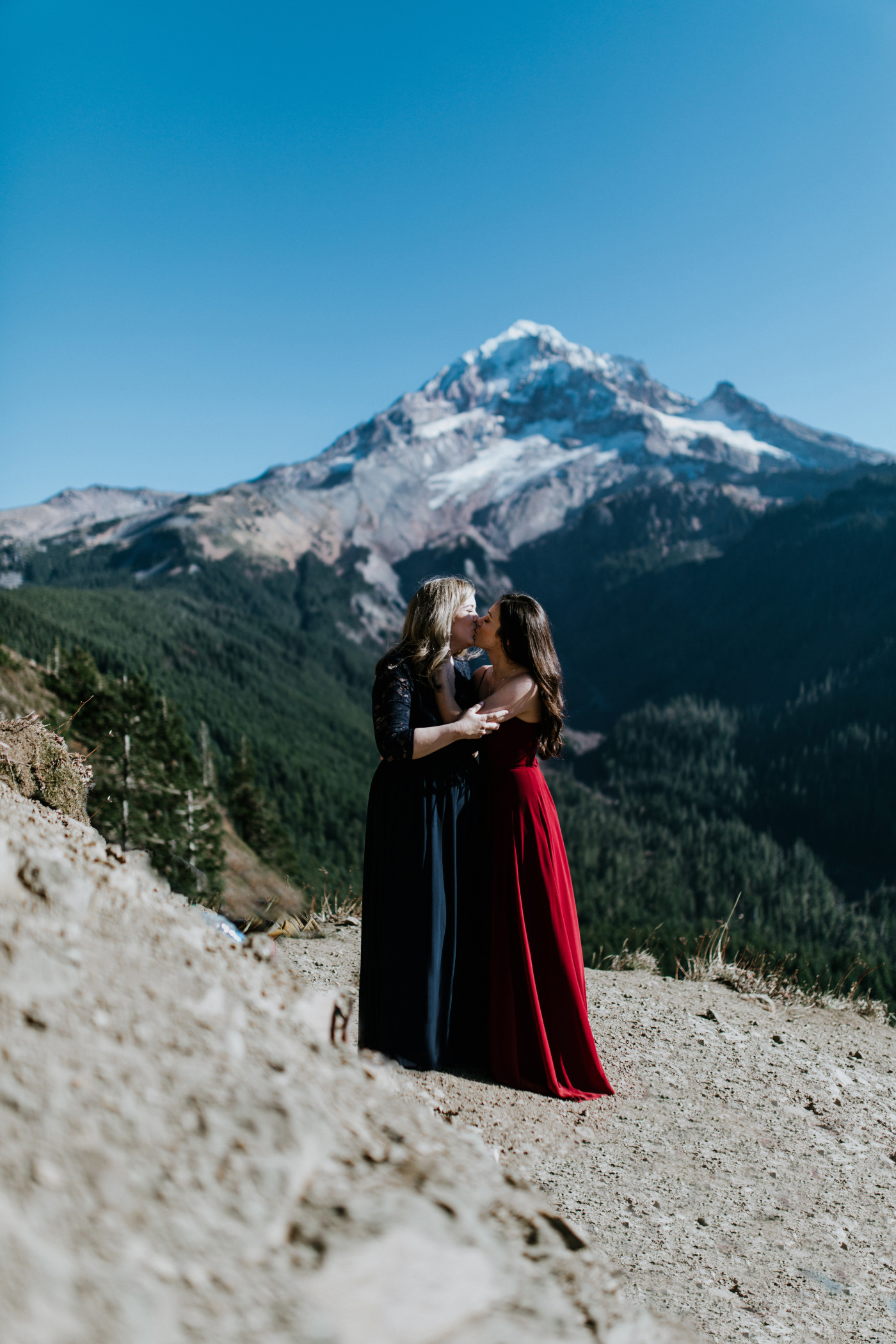 Tiffany and Hayley kiss with Mt Hood as the backdrop. Elopement photography at the Columbia River Gorge by Sienna Plus Josh.