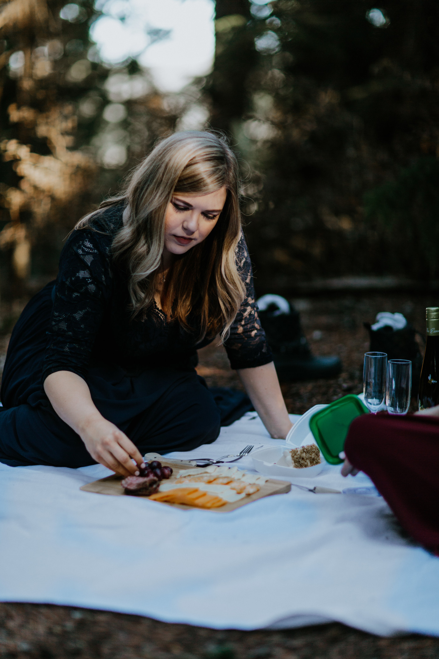 Tiffany and Hayley enjoy a lunch in the woods. Elopement photography at the Columbia River Gorge by Sienna Plus Josh.
