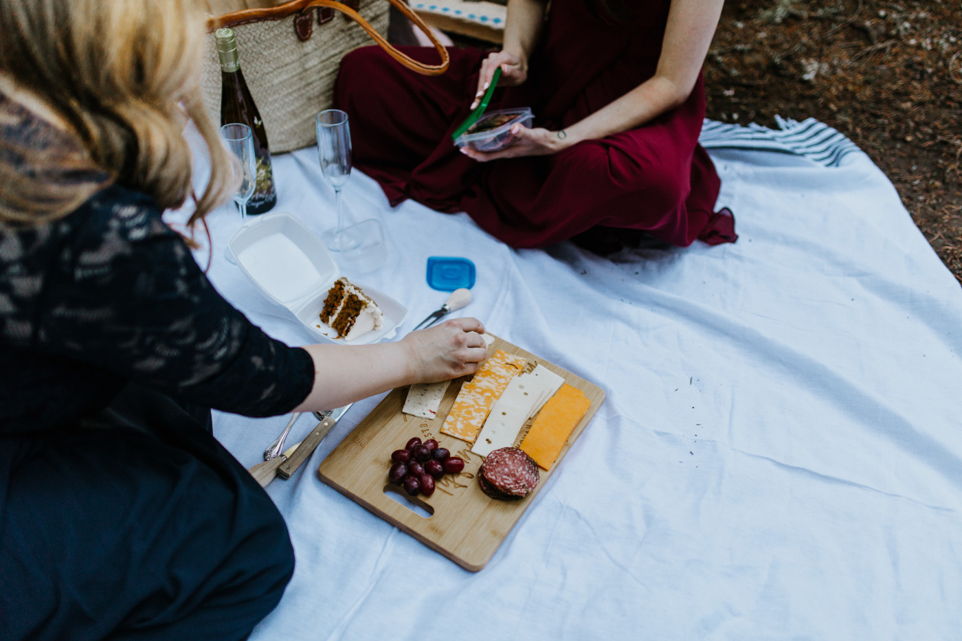 Tiffany and Hayley sit and have a picnic in the forest of Mt Hood. Elopement photography at the Columbia River Gorge by Sienna Plus Josh.