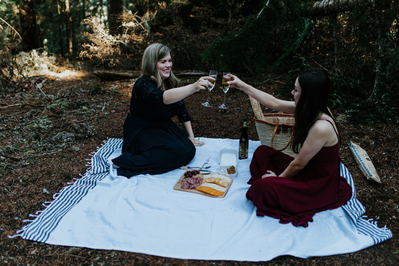 Tiffany and Hayley cheers. Elopement photography at the Columbia River Gorge by Sienna Plus Josh.