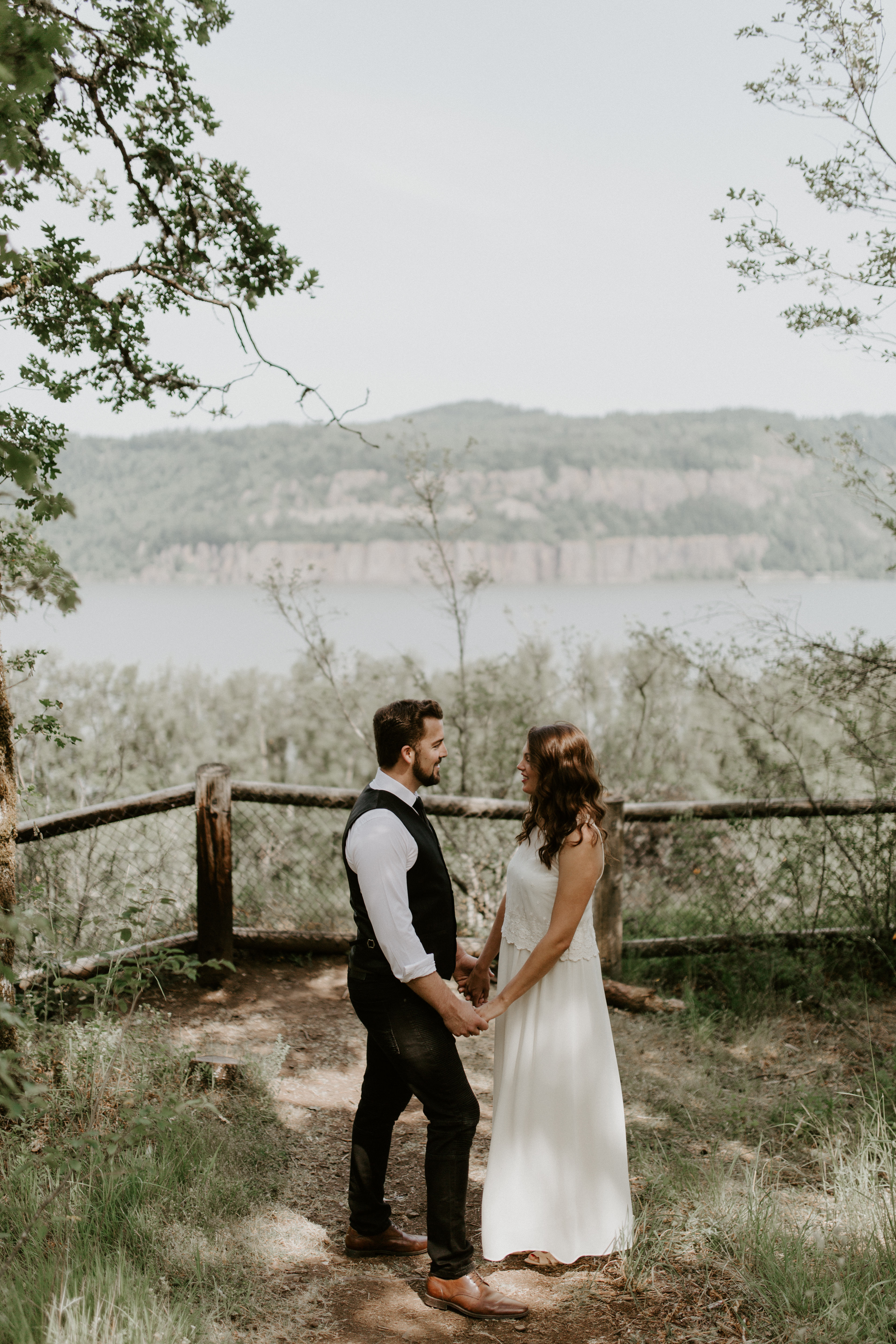 Emily and Josh holding hands at Bridal Veil Falls, Oregon. Elopement photography in Portland Oregon by Sienna Plus Josh.
