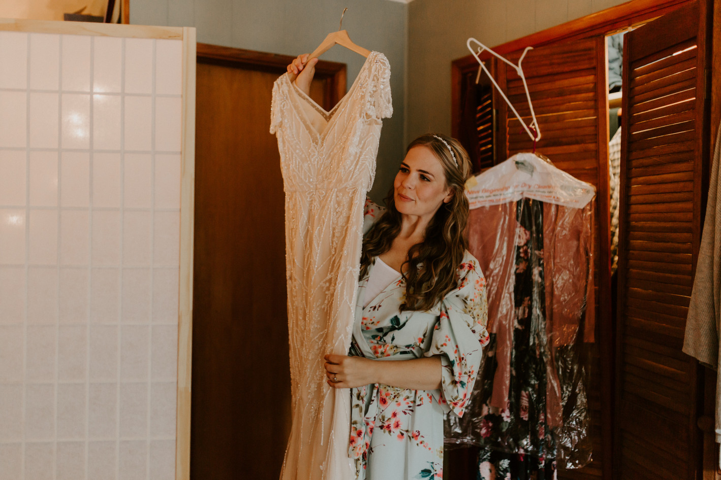 Hannah looks at her dress in Corvallis in Oregon. Intimate wedding photography in Corvallis Oregon by Sienna Plus Josh.
