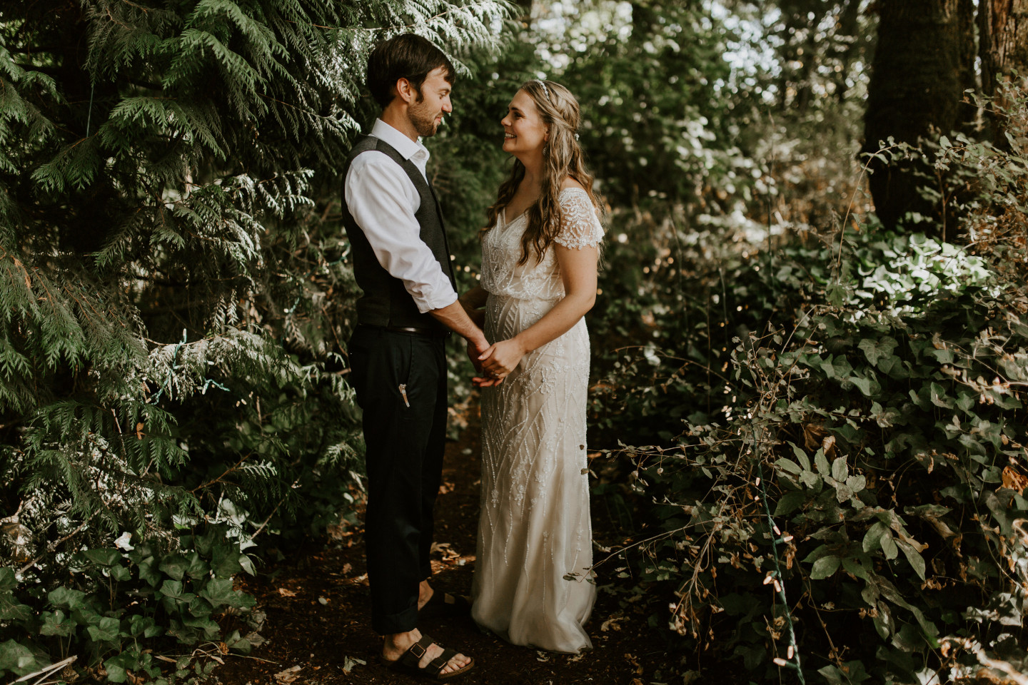 Dan holds Hannah's hands in Corvallis, Oregon. Intimate wedding photography in Corvallis Oregon by Sienna Plus Josh.