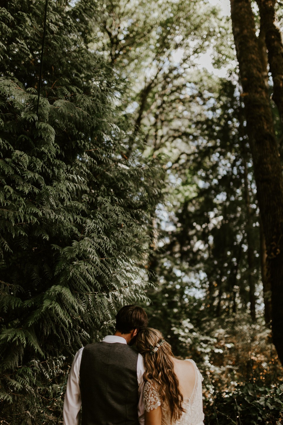Hannah and Dan rest their heads on each other in Corvallis, Oregon. Intimate wedding photography in Corvallis Oregon by Sienna Plus Josh.