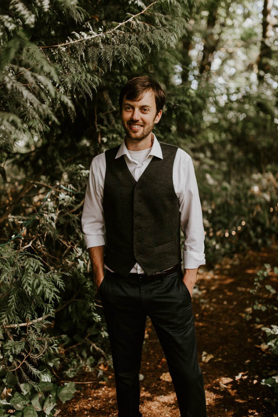 Dan stands in the woods in Corvallis, Oregon. Intimate wedding photography in Corvallis Oregon by Sienna Plus Josh.