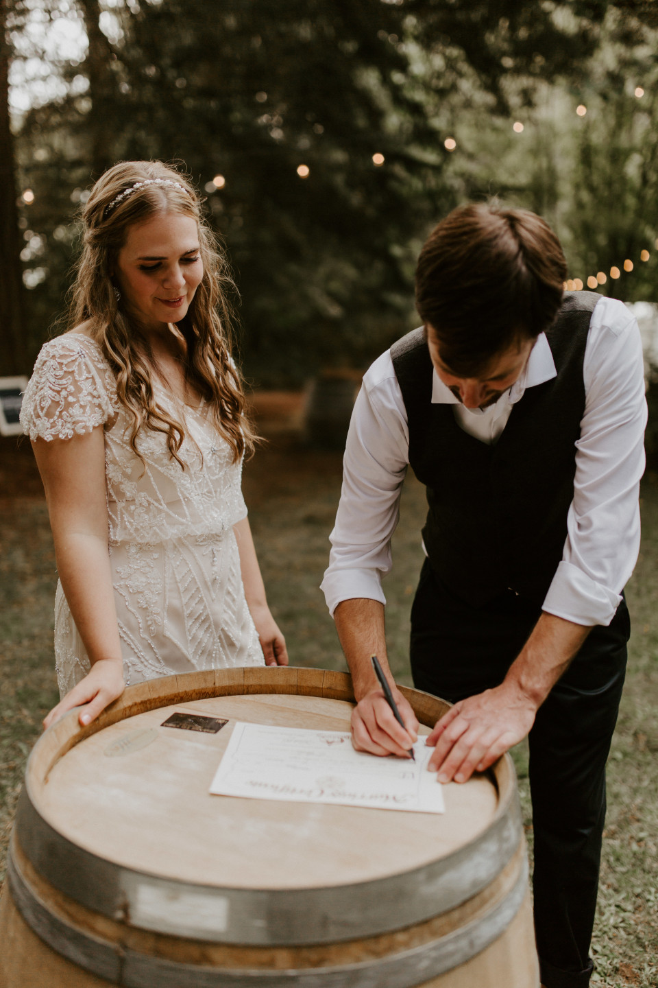 Hannah and Dan sign their marriage certificate in Corvallis, Oregon. Intimate wedding photography in Corvallis Oregon by Sienna Plus Josh.