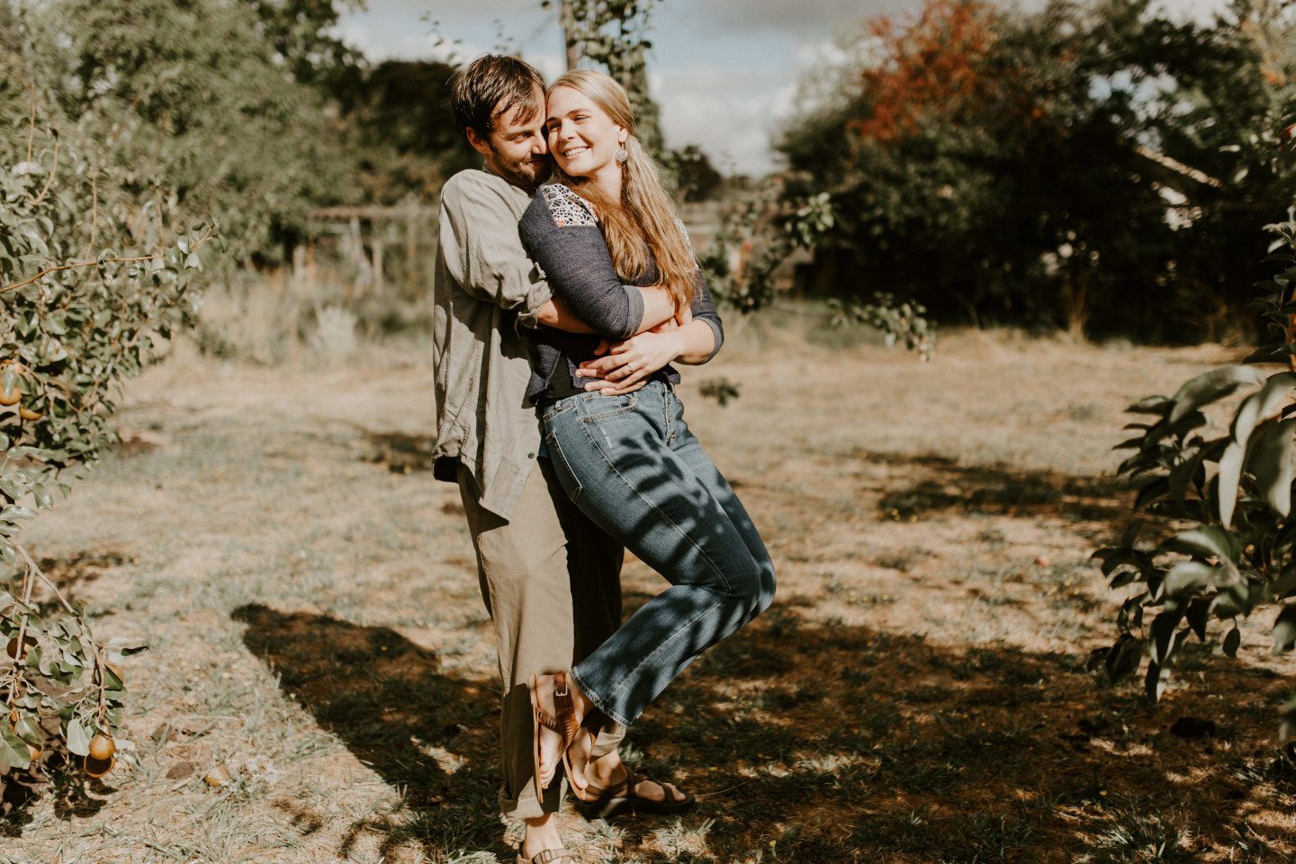 Dan holds Hannah in their backyard. Intimate wedding photography in Corvallis Oregon by Sienna Plus Josh.
