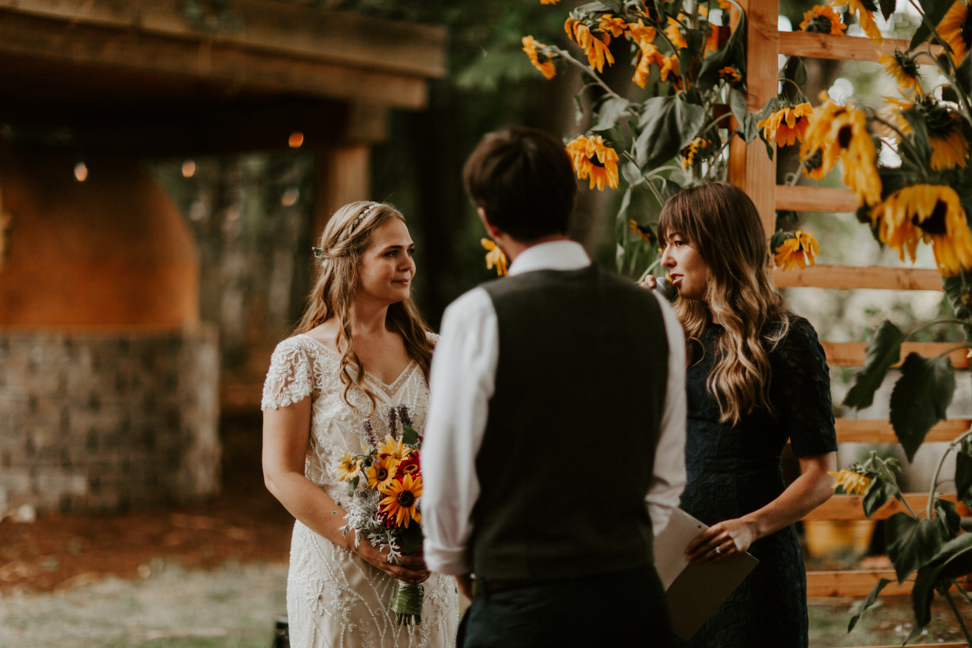 Hannah and Dan face each other at the altar in Corvallis, Oregon. Intimate wedding photography in Corvallis Oregon by Sienna Plus Josh.