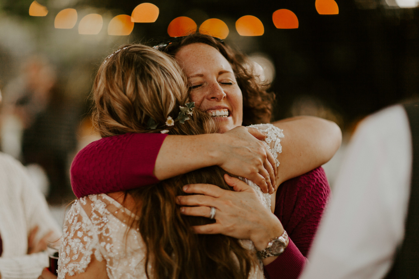 Hannah hugs a guest in Corvallis, Oregon. Intimate wedding photography in Corvallis Oregon by Sienna Plus Josh.