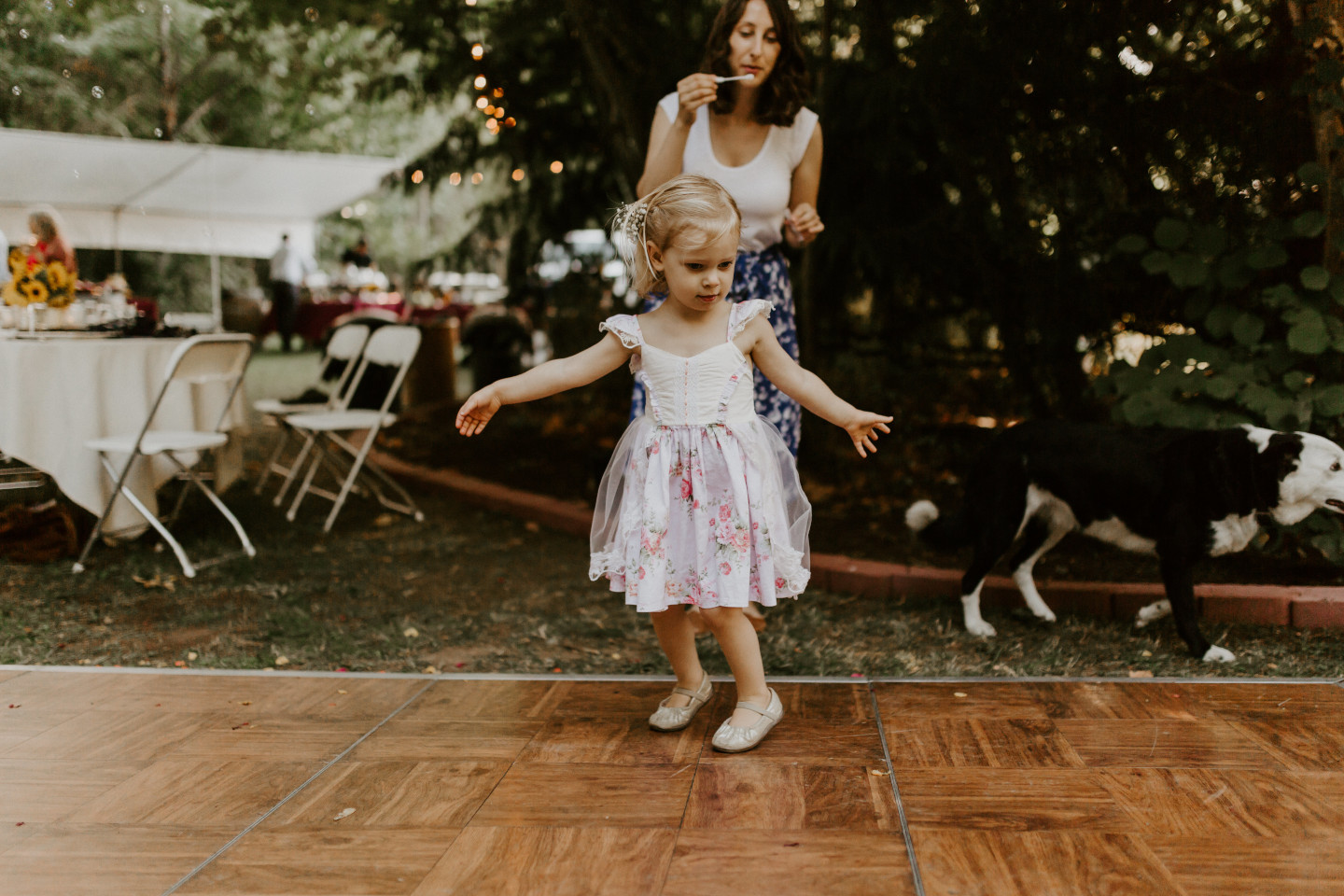 A little girl dances at the wedding in Corvallis, Oregon. Intimate wedding photography in Corvallis Oregon by Sienna Plus Josh.