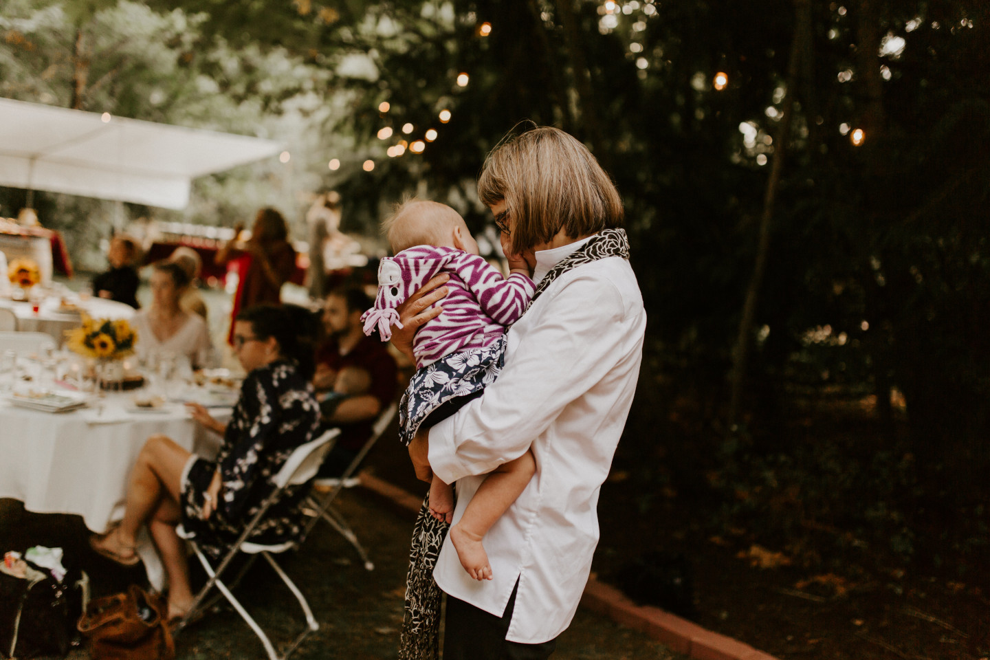 A woman dances with a baby in Corvallis, Oregon. Intimate wedding photography in Corvallis Oregon by Sienna Plus Josh.