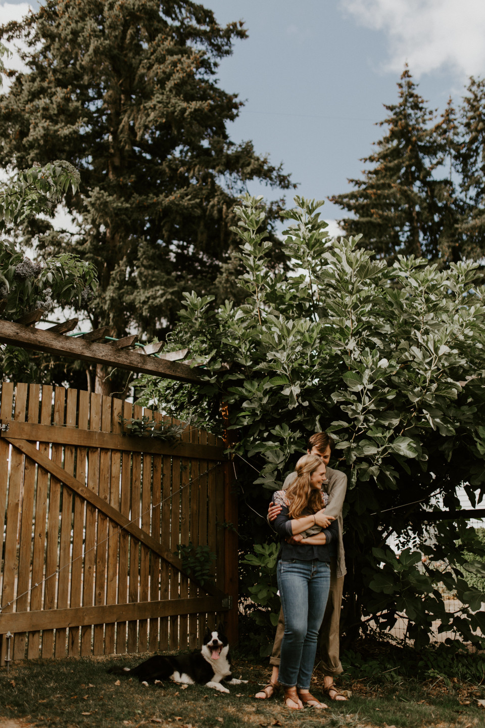 Dan and Hannah's dog sits next to them in Corvallis, Oregon. Intimate wedding photography in Corvallis Oregon by Sienna Plus Josh.