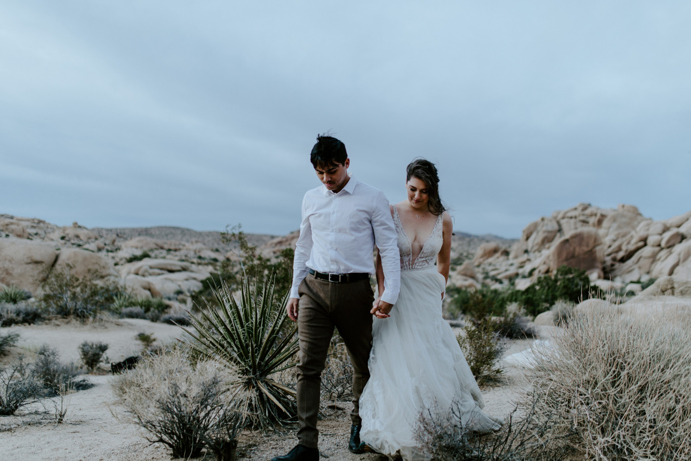 Shelby and Zack walk side by side in Joshua Tree National Park.