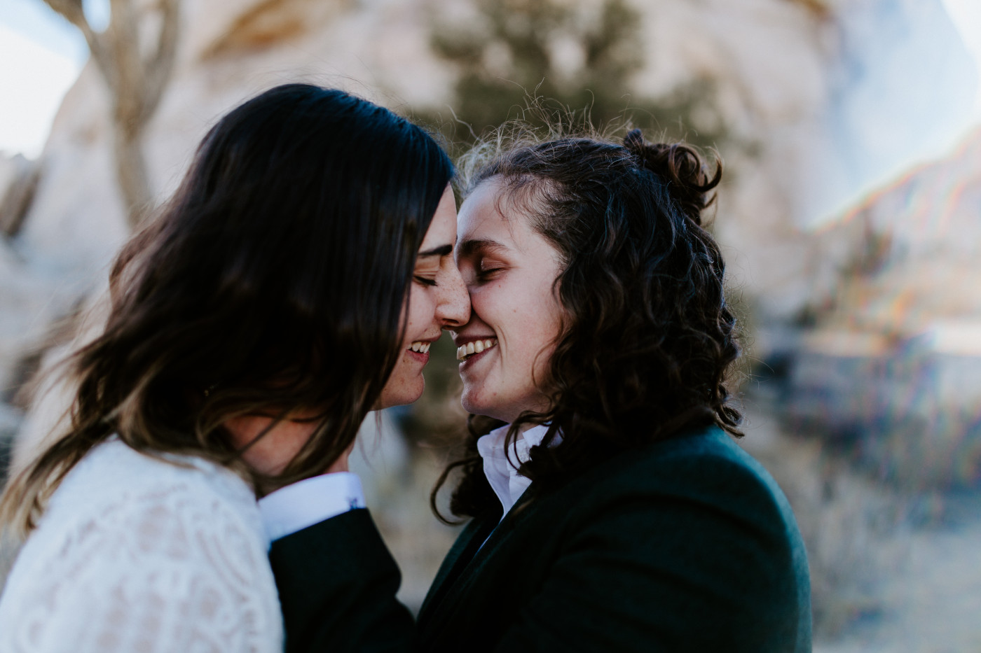Becca and Madison kiss in the Joshua Tree National Park.