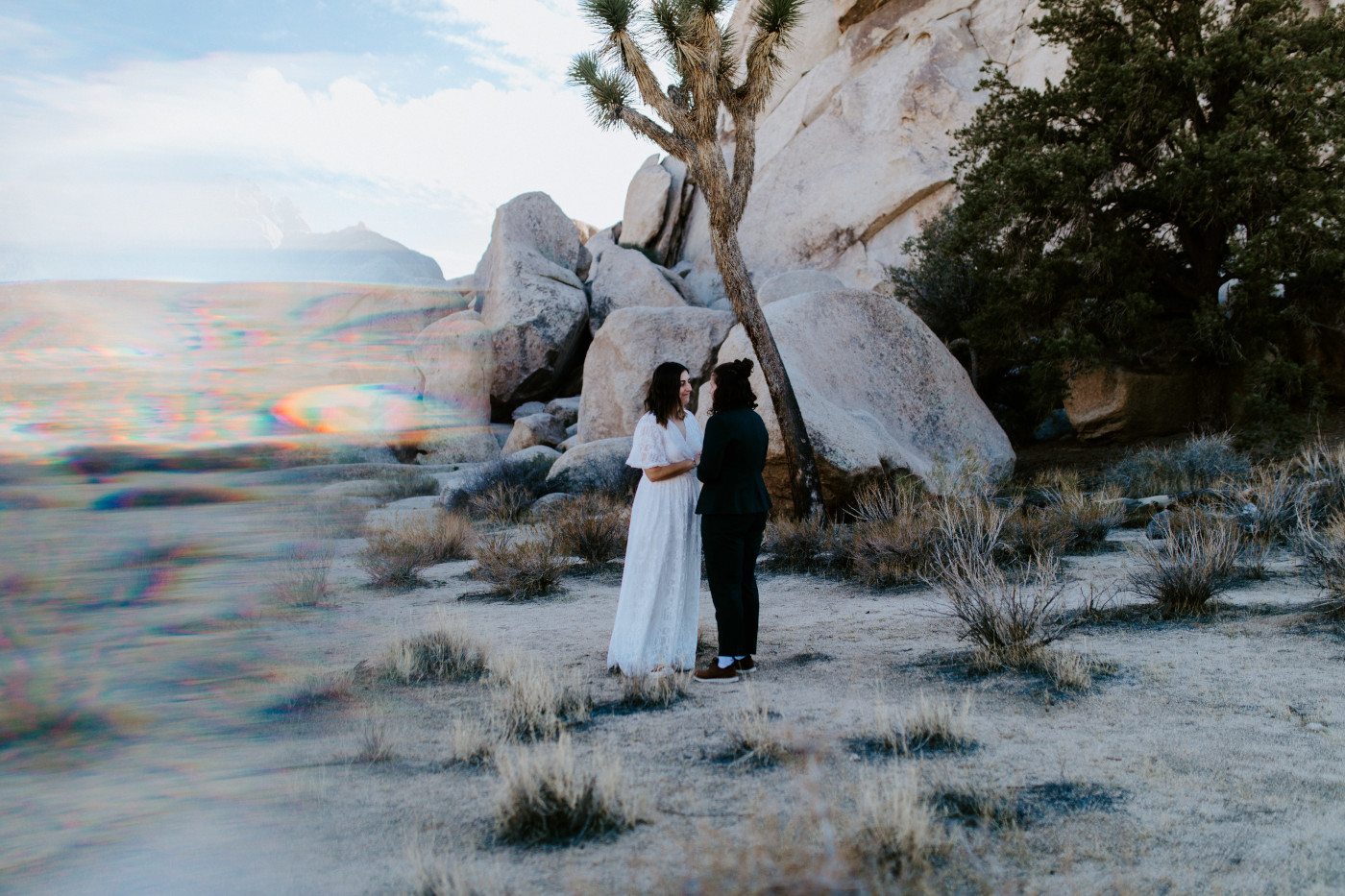 Madison and Becca kiss in the desert.