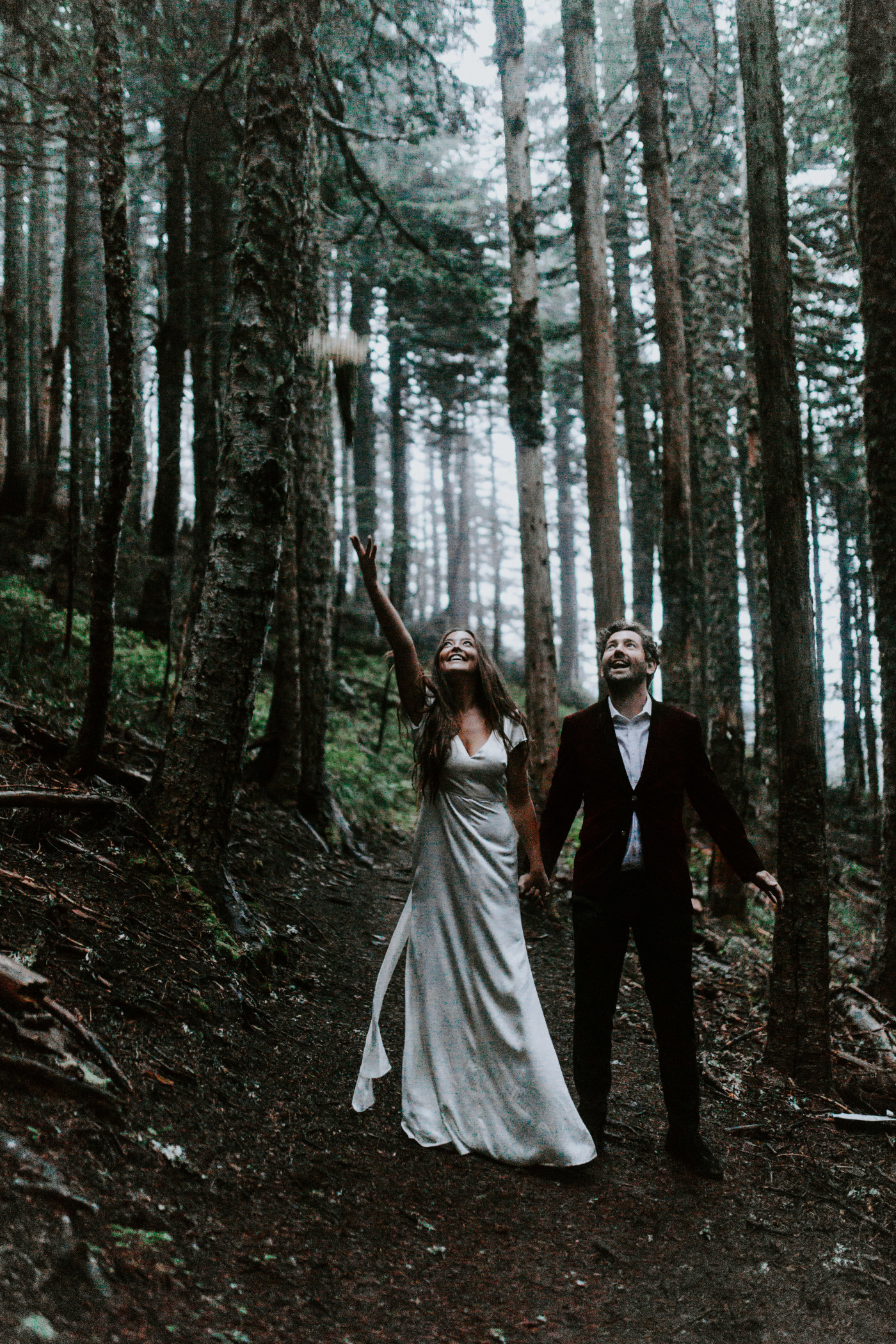 Katelyn throws her bouquet while holding hands with Murray. Elopement wedding photography at Mount Hood by Sienna Plus Josh.