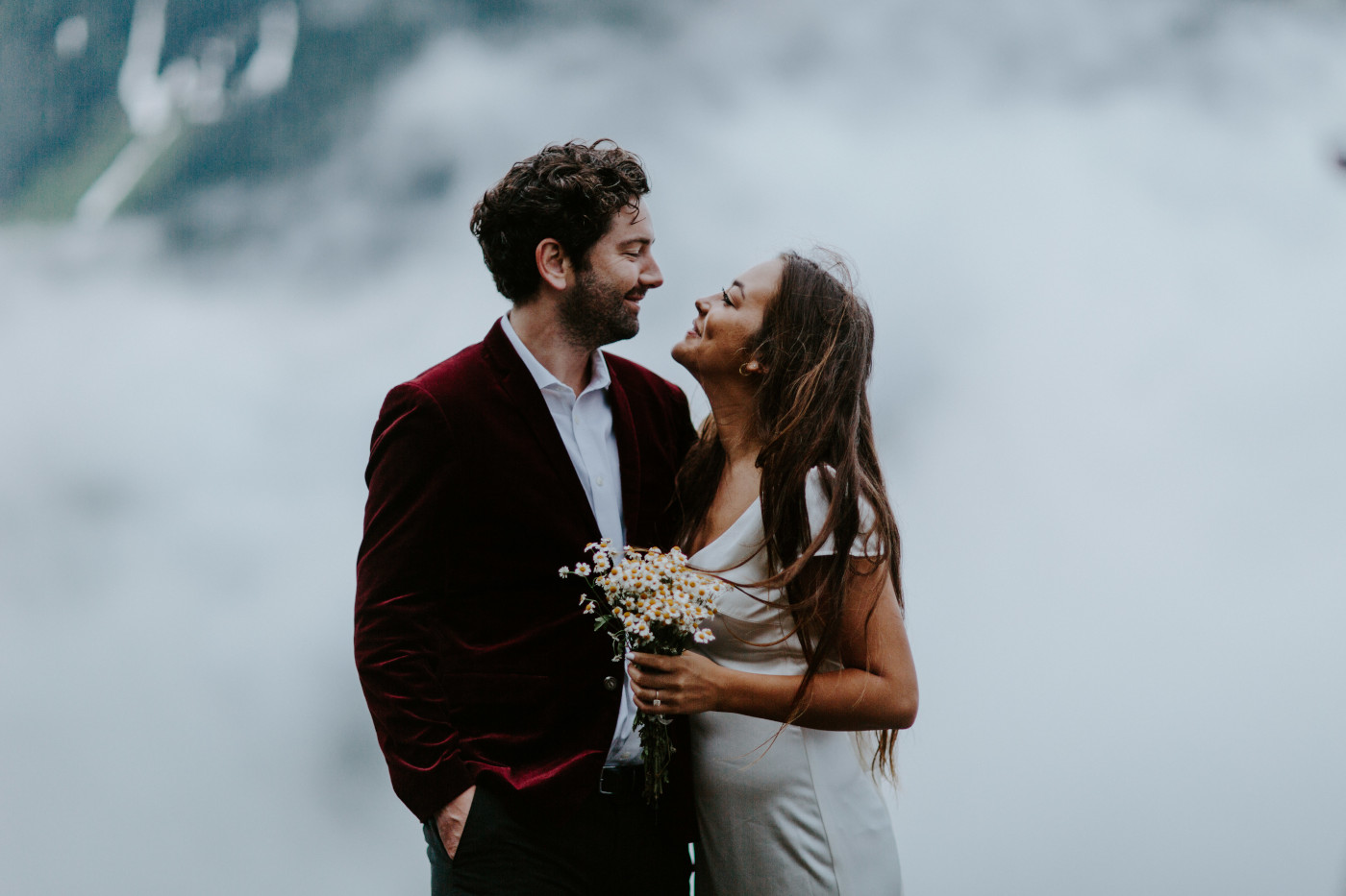 Katelyn and Murray stand in front of the clouds at Mount Hood. Elopement wedding photography at Mount Hood by Sienna Plus Josh.
