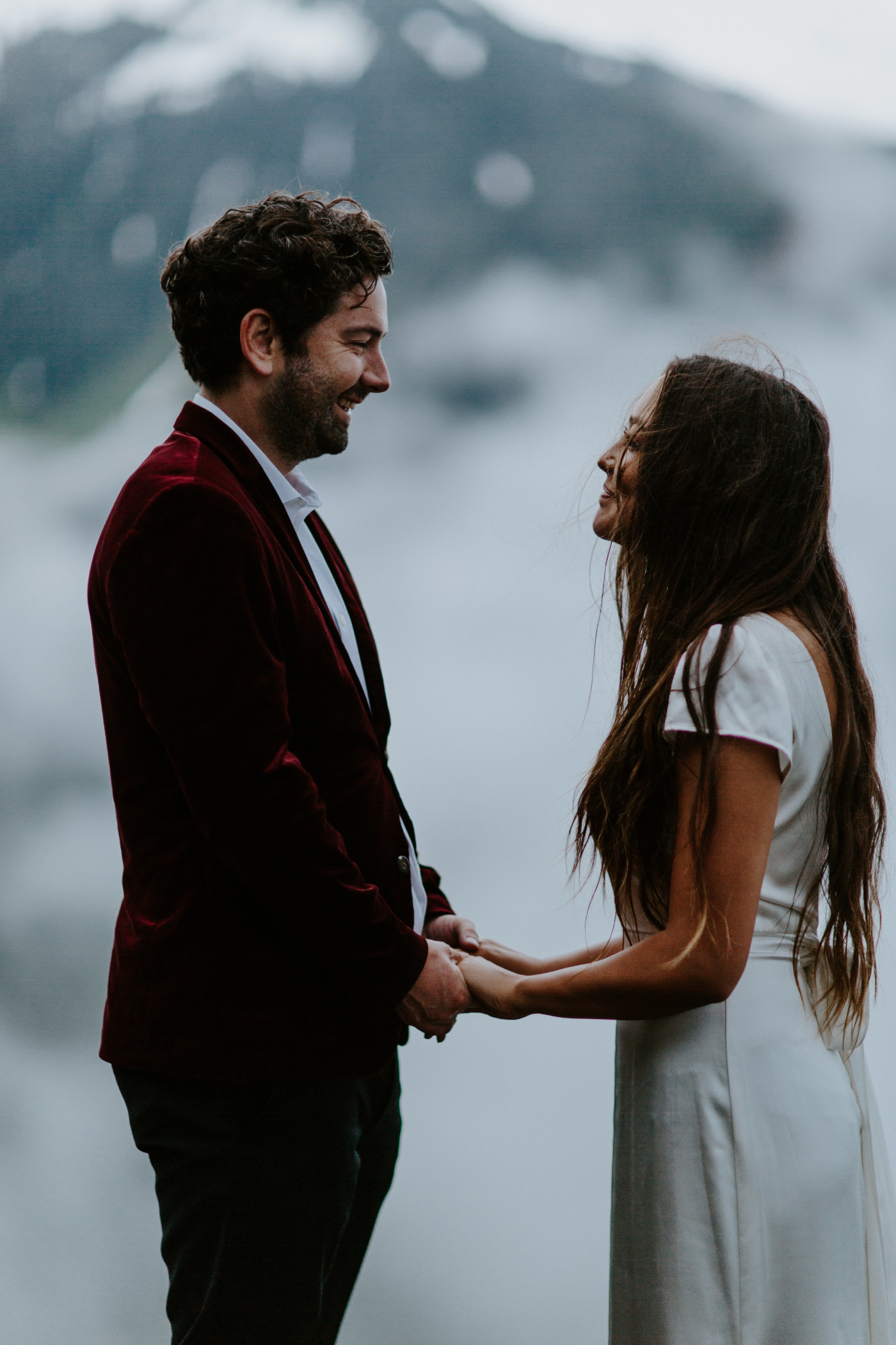 Katelyn and Murray standing face to face during their ceremony. Elopement wedding photography at Mount Hood by Sienna Plus Josh.