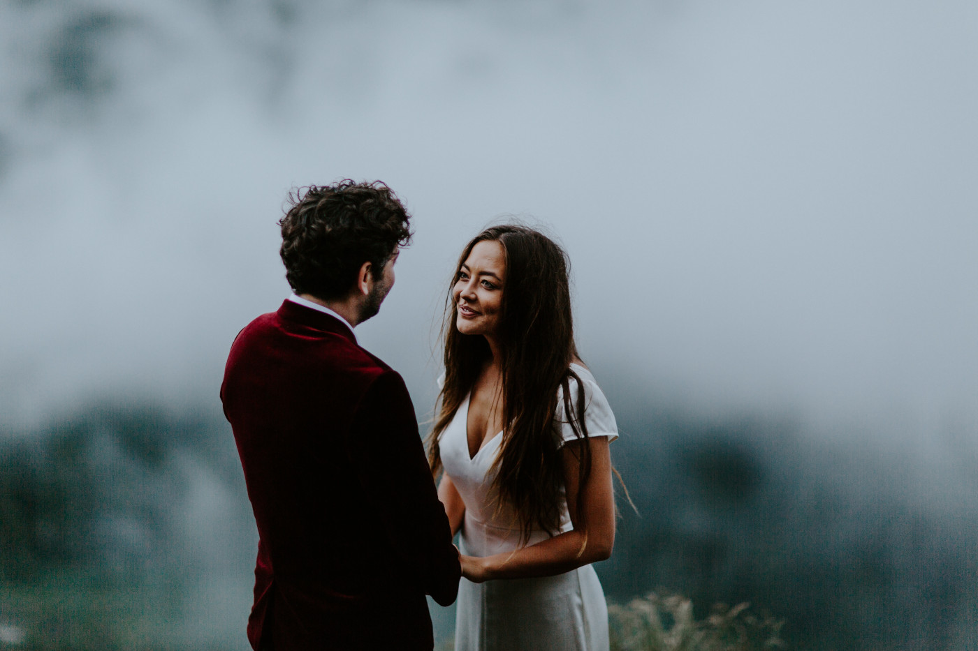 Katelyn smiles at Murray in front of the clouds. Elopement wedding photography at Mount Hood by Sienna Plus Josh.