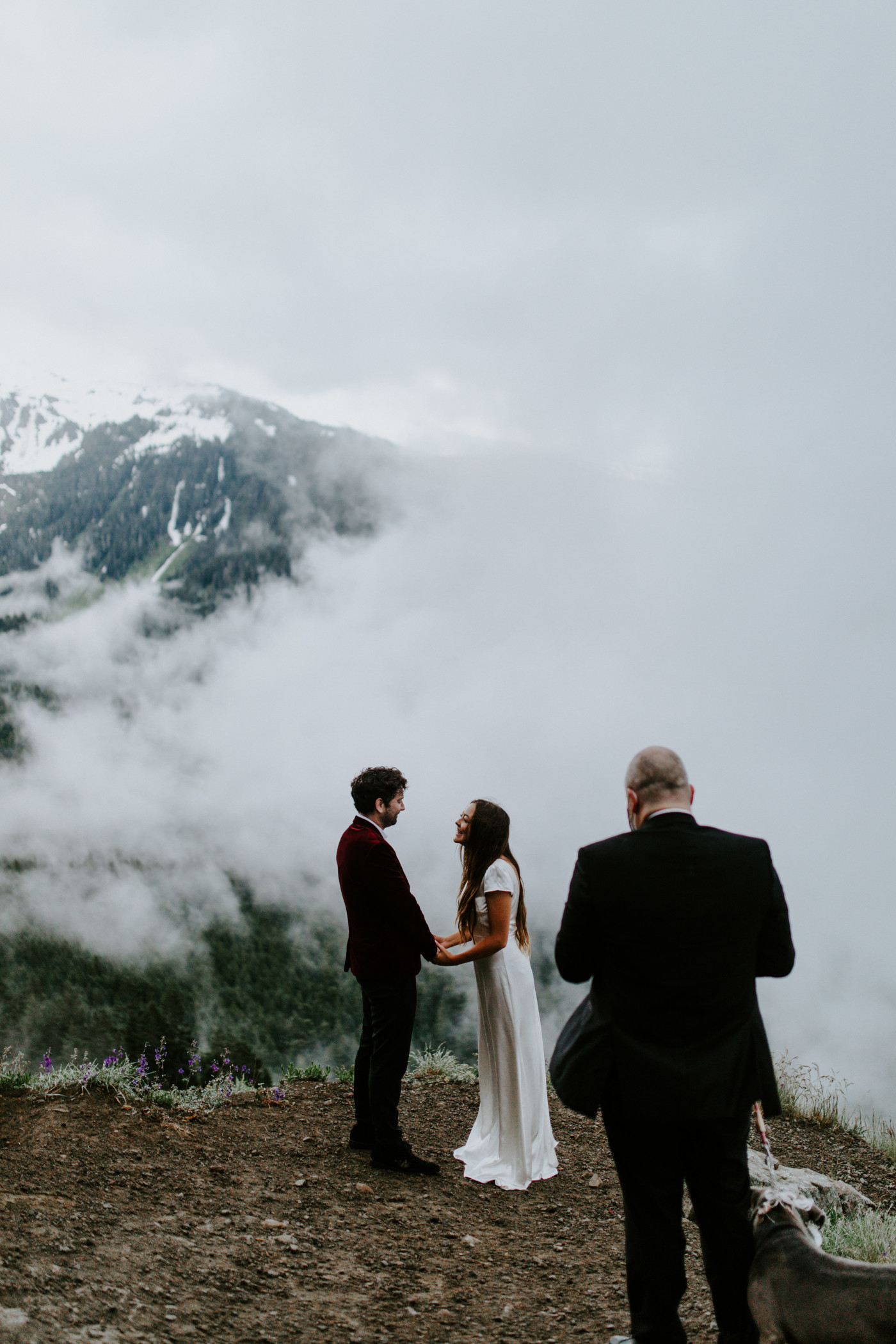 Murray and Katelyn stand face to face as their officiant reads to them. Elopement wedding photography at Mount Hood by Sienna Plus Josh.