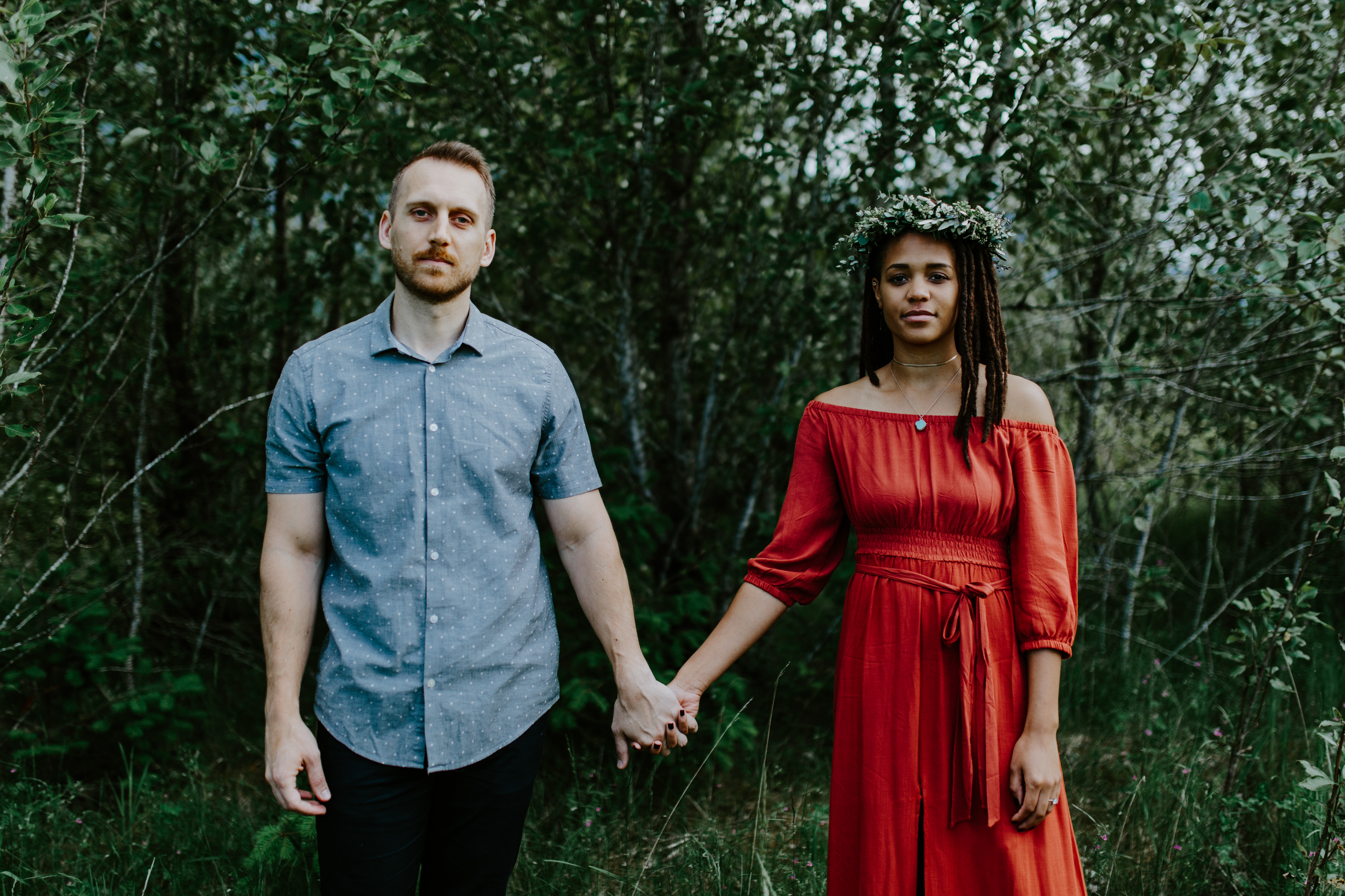 Kayloni and Garrett hold hands at Cascade Locks, Oregon during their elopement. Engagement photography in Portland Oregon by Sienna Plus Josh.