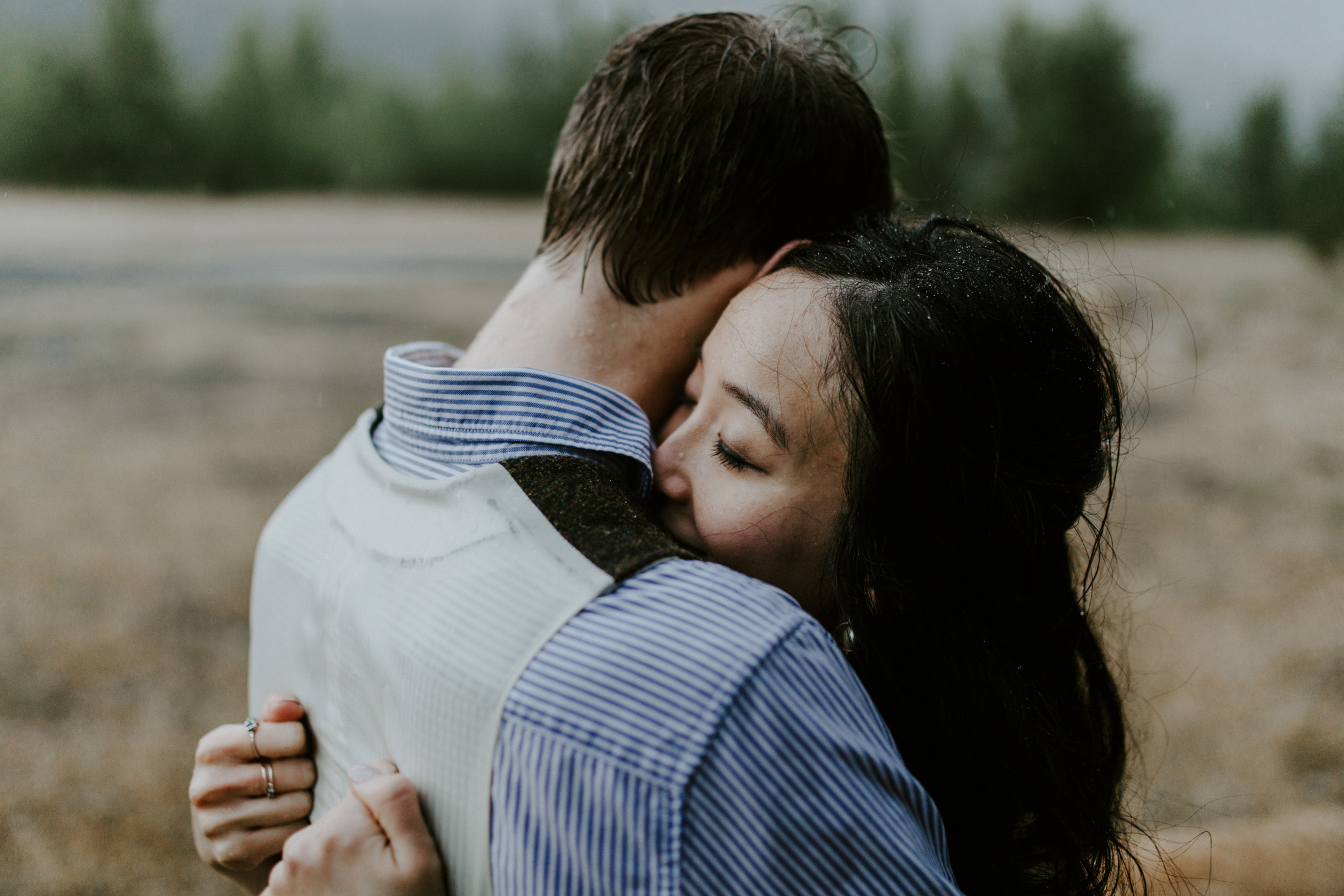 Kimberlie holds on to Jacob at Cascade Locks. Elopement wedding photography at Cascade Locks by Sienna Plus Josh.