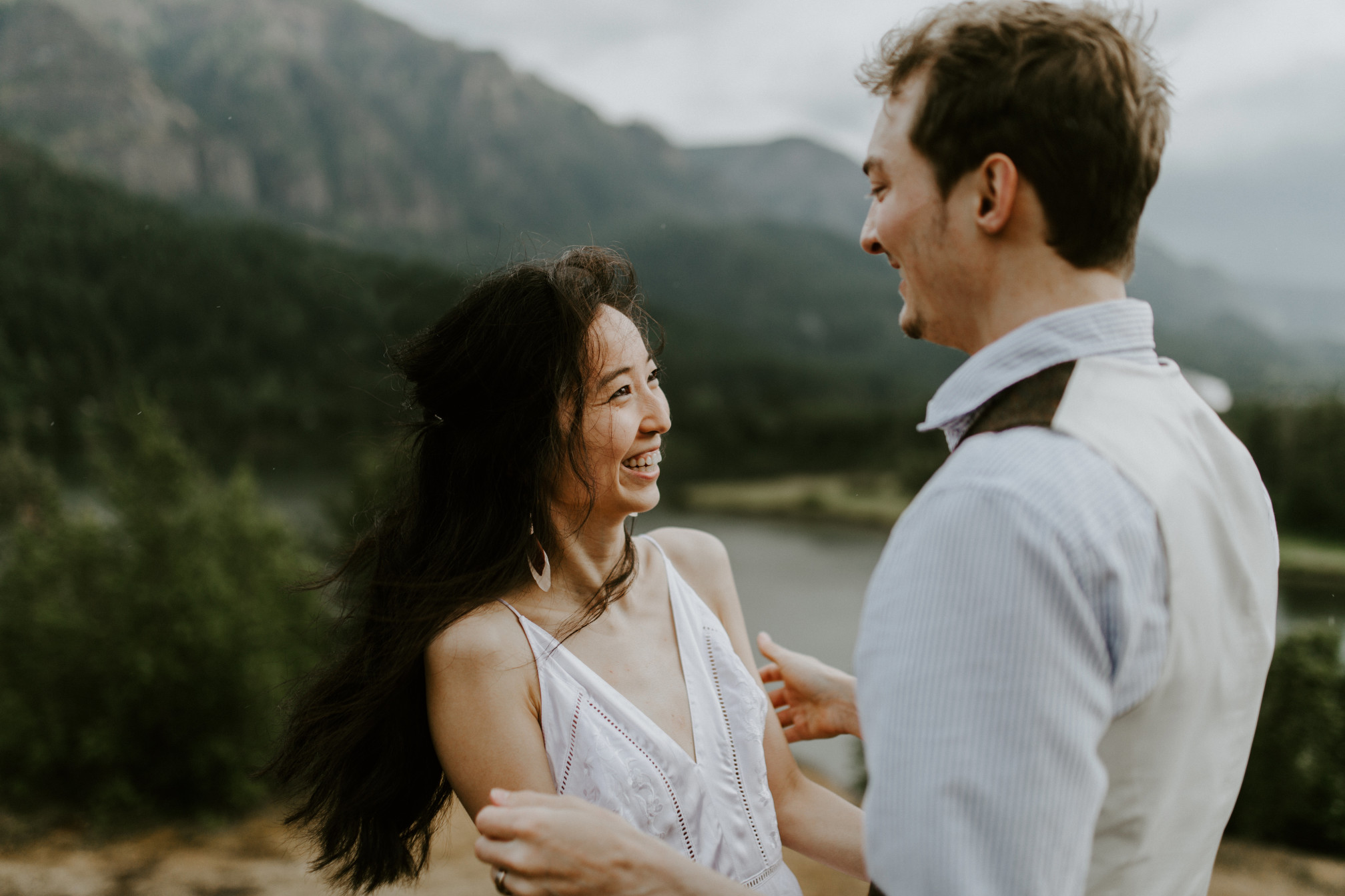 Jacob and Kimberlie smile at each other. Elopement wedding photography at Cascade Locks by Sienna Plus Josh.