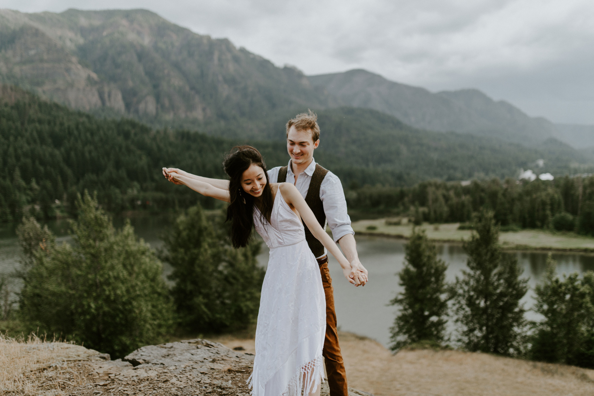 Jacob and Kimberlie stand near the cliff of Cascade Locks. Elopement wedding photography at Cascade Locks by Sienna Plus Josh.