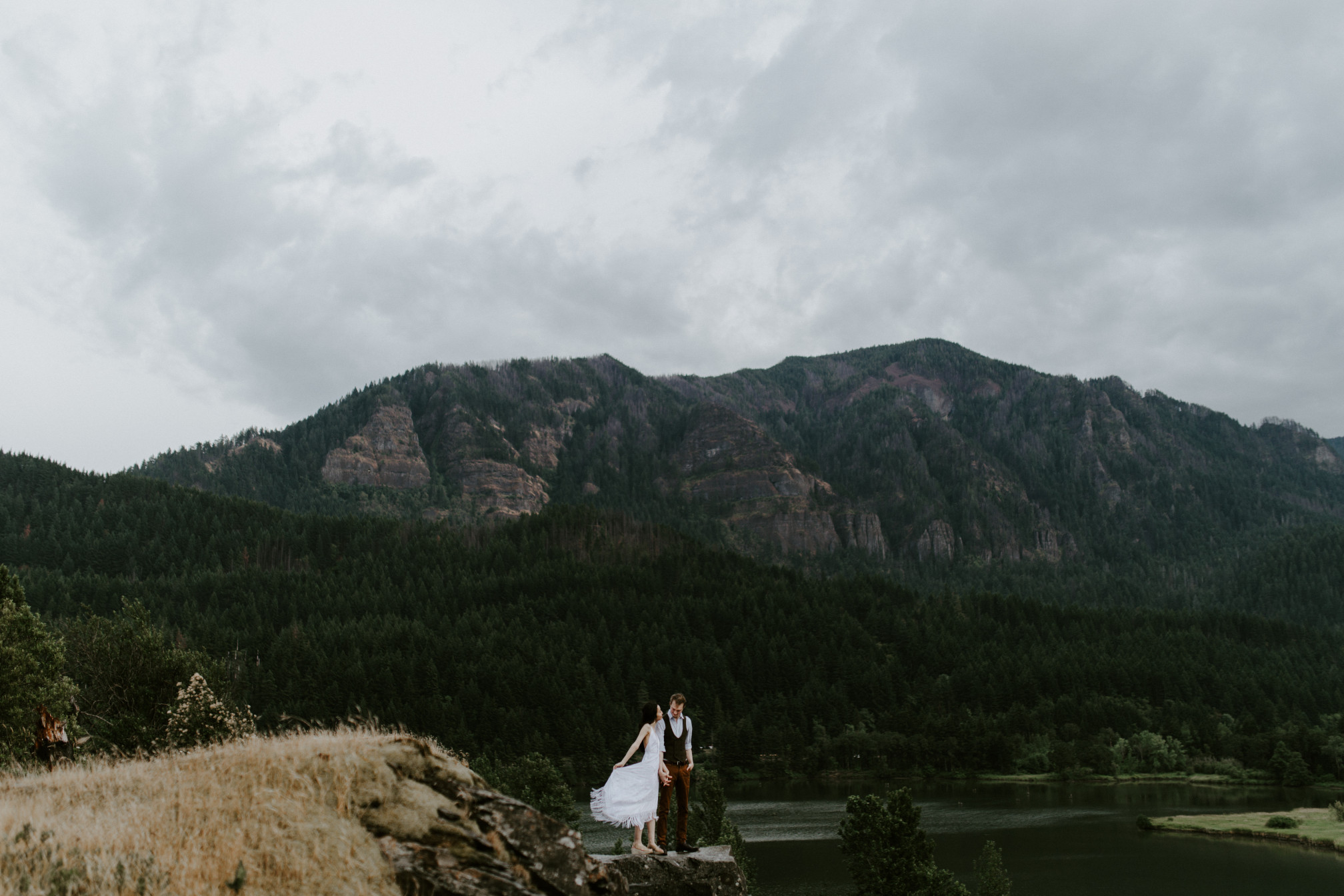 Jacob and Kimberlie at the cliff line of Cascade Locks. Elopement wedding photography at Cascade Locks by Sienna Plus Josh.