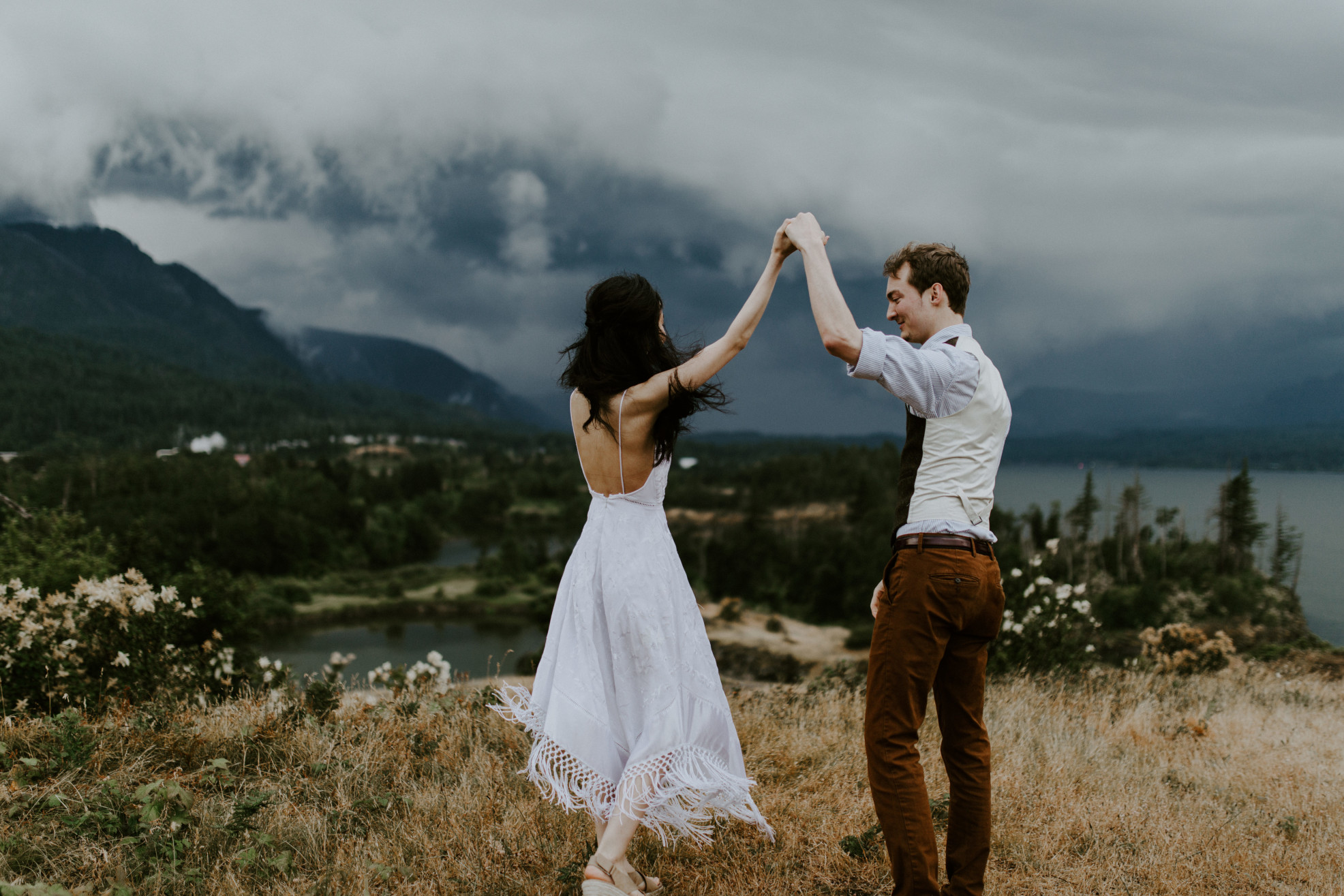 Jacob and Kimberlie dance with a view of the Columbia River Gorge. Elopement wedding photography at Cascade Locks by Sienna Plus Josh.