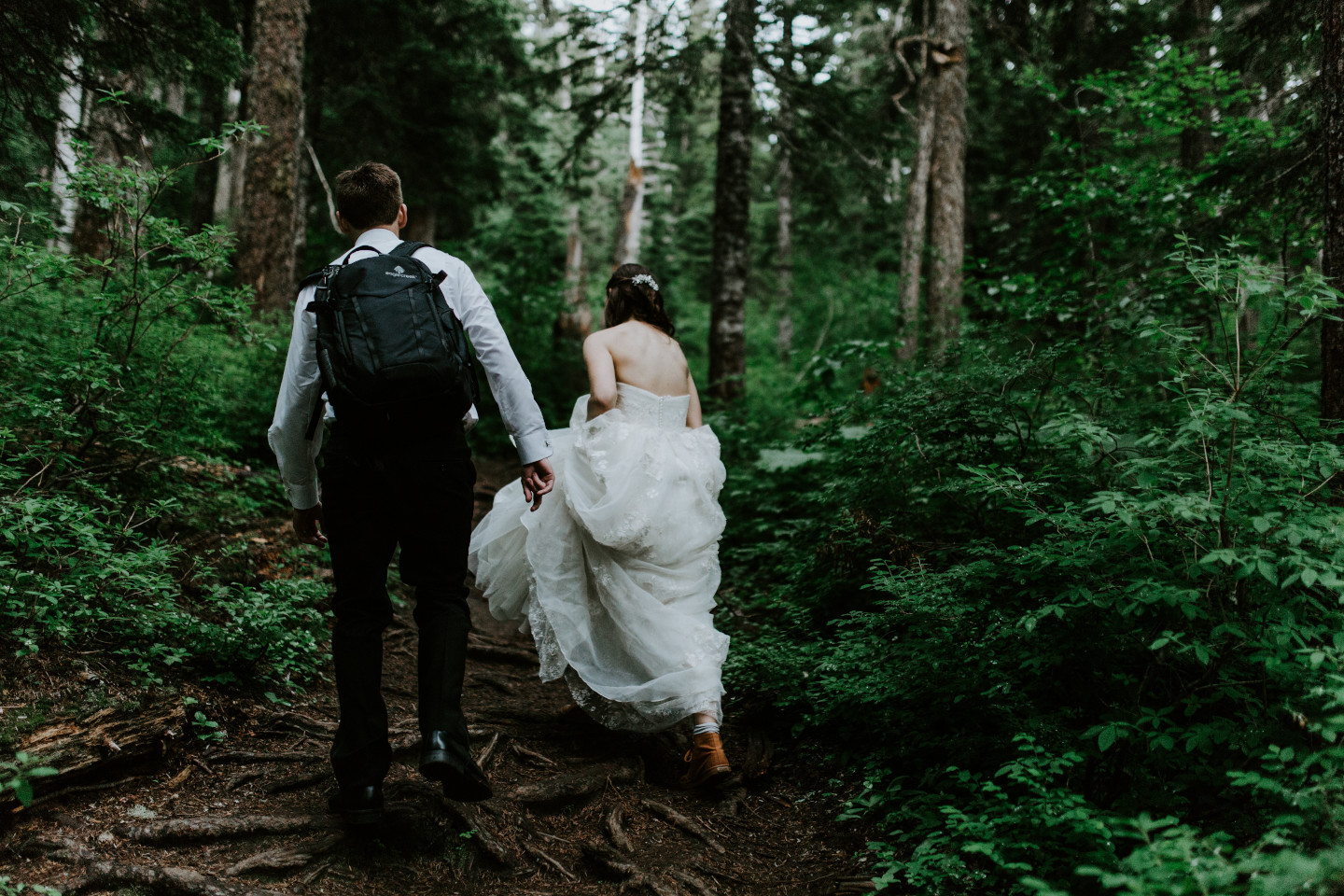 Moira and Ryan walk along a trail towards Mount Hood. Adventure elopement wedding shoot by Sienna Plus Josh.