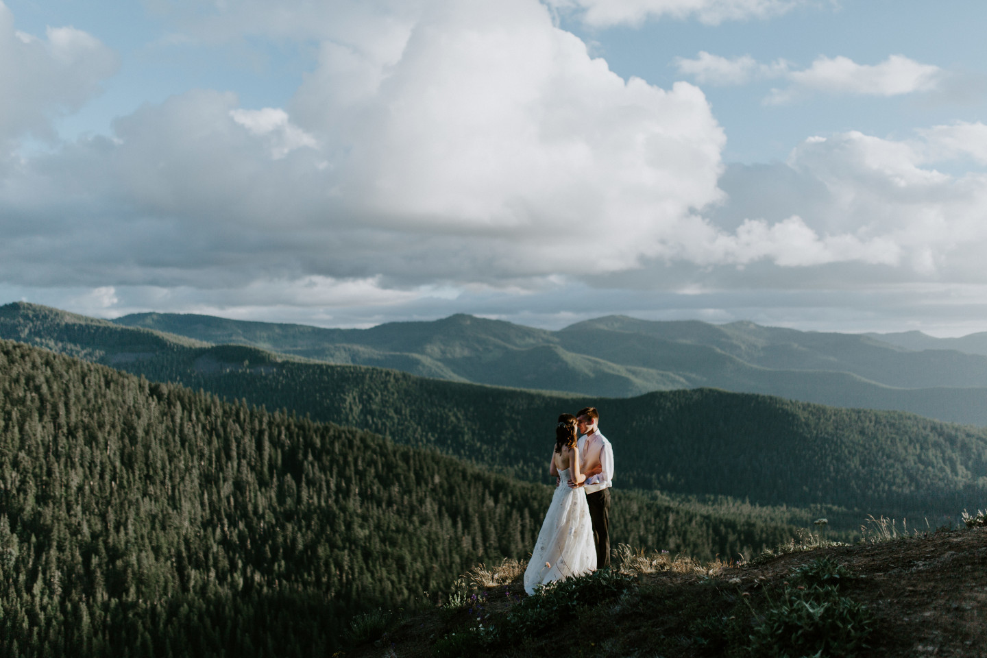 Moira and Ryan move in for a kiss at Mount Hood. Adventure elopement wedding shoot by Sienna Plus Josh.