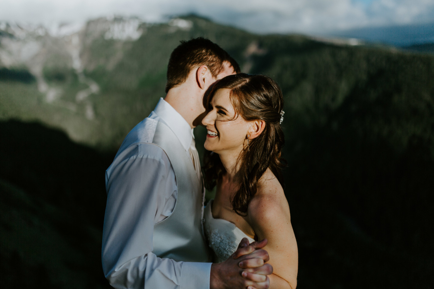Ryan and Moira move in for a kiss in front of Mount Hood. Adventure elopement wedding shoot by Sienna Plus Josh.